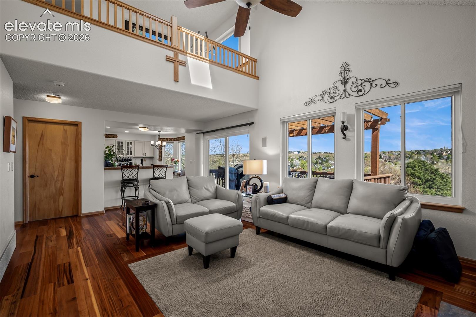 Seanic view of park looking back to kitchen from the family room.  
Loft above