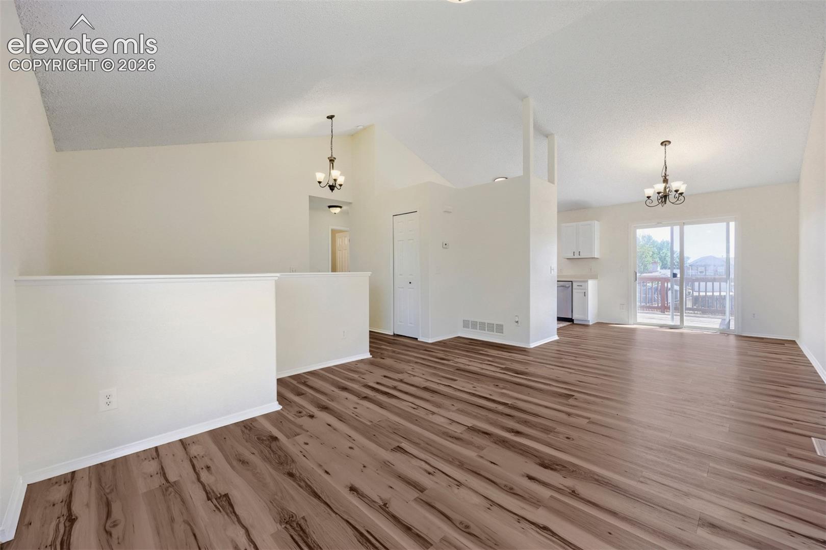 Vaulted ceilings complement the wood-finish flooring