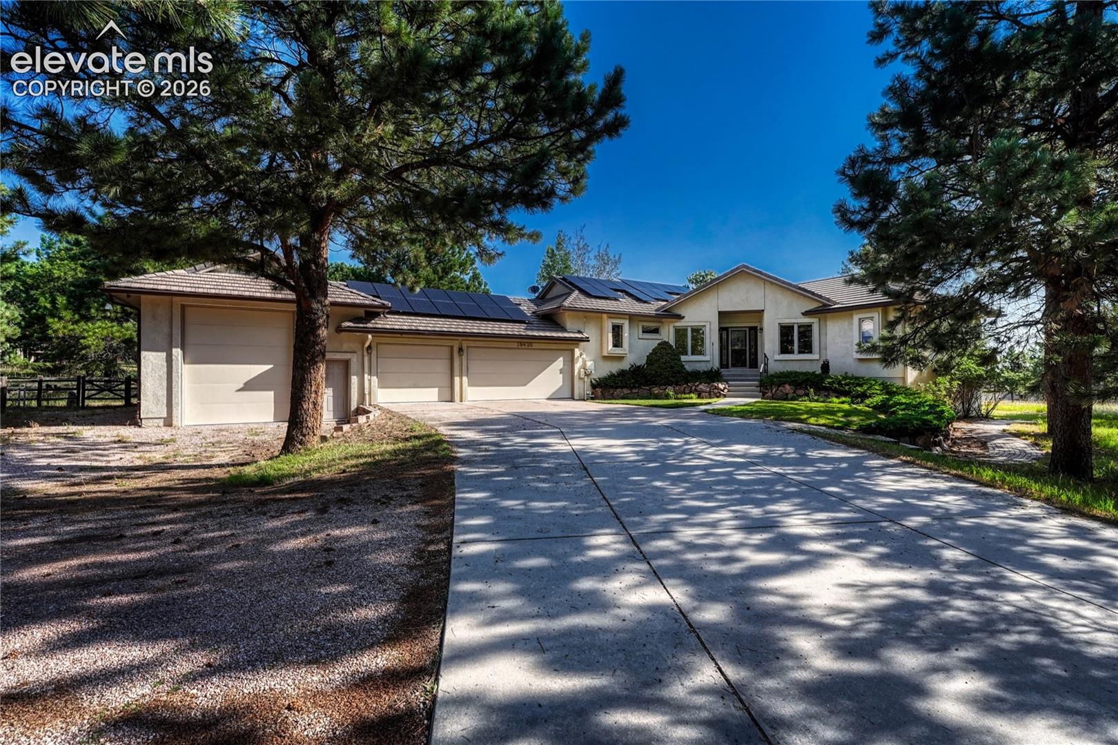 Concrete driveway with a half circle turnaround.