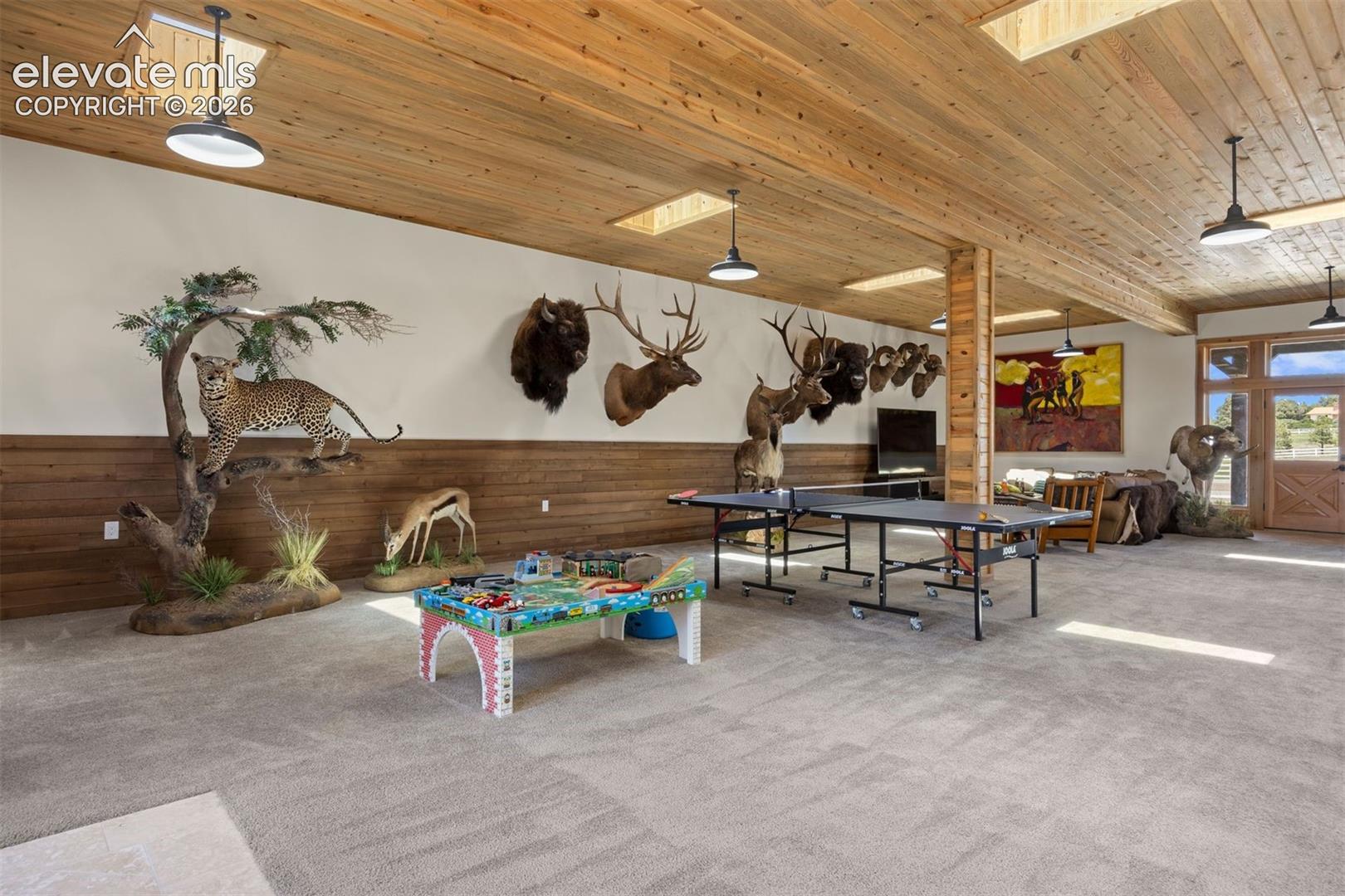 The Game Barn offers 1,788 square feet with plenty of space for a large media area, game tables, and a gym, plus a private office.