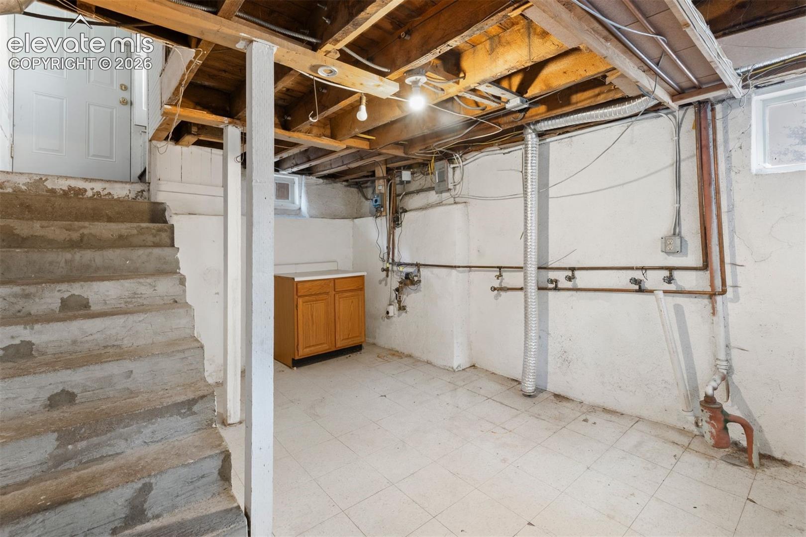 Unfinished basement/laundry area