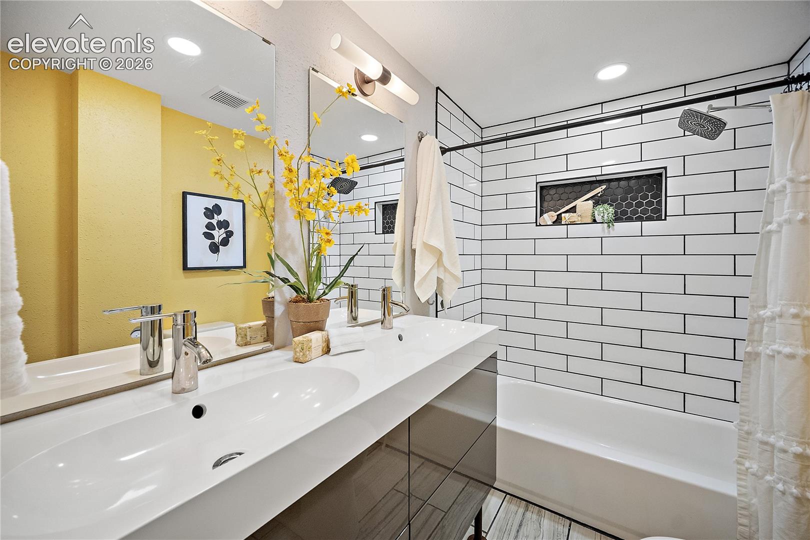 Dual-sink vanity with chrome faucets and integrated countertop