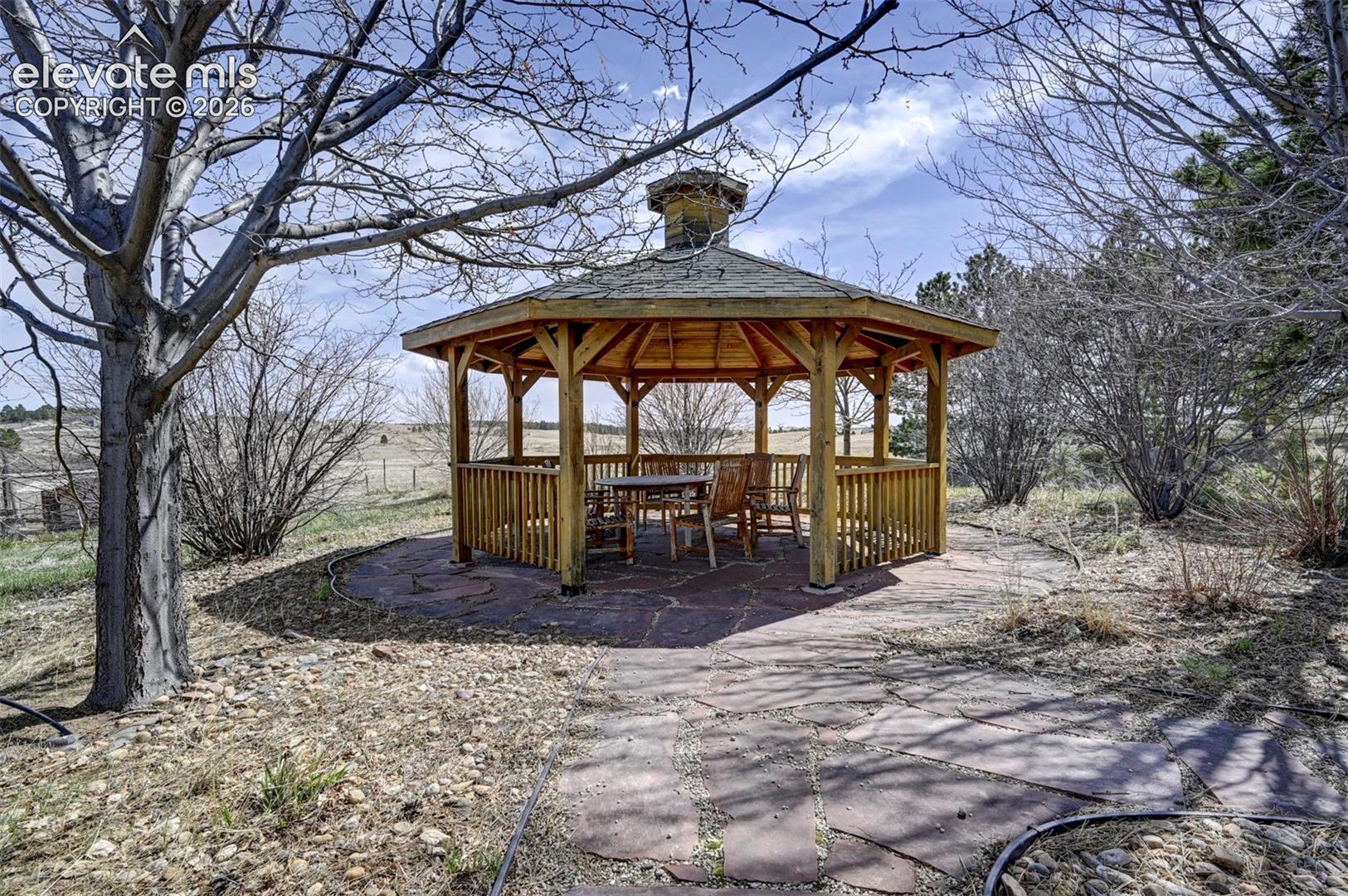 Gazebo surrounded by mature trees