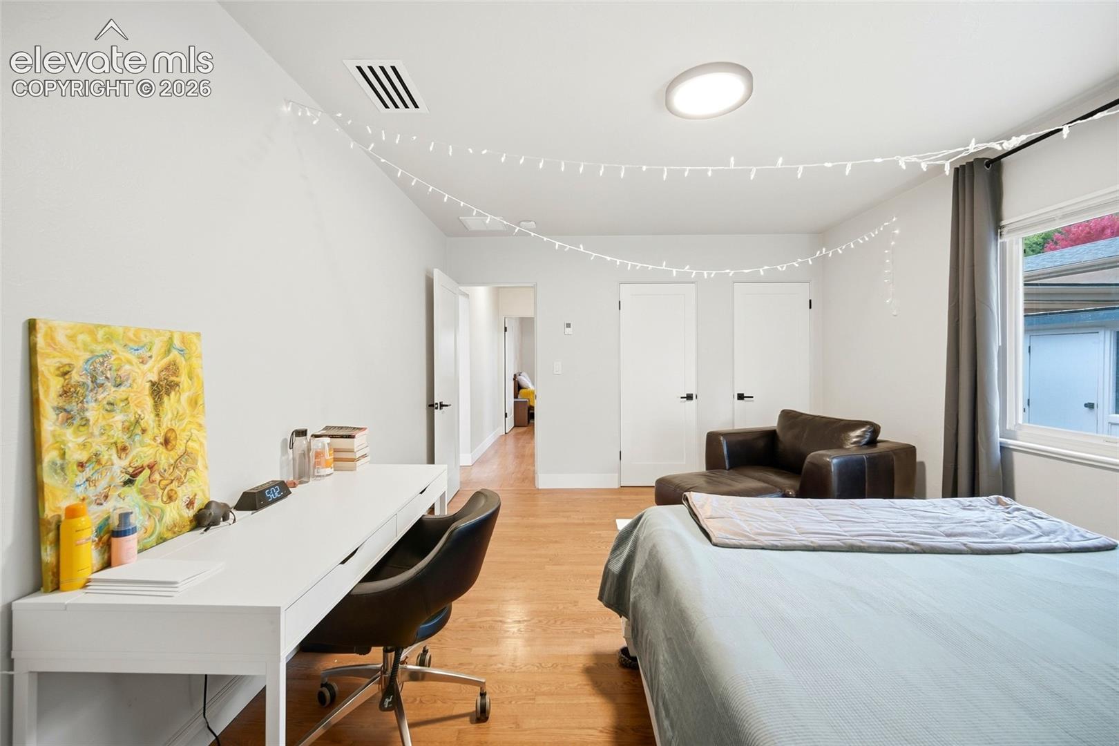 With two closets and an adjacent bath, this second main-floor bedroom is a great space to start and end your days. 