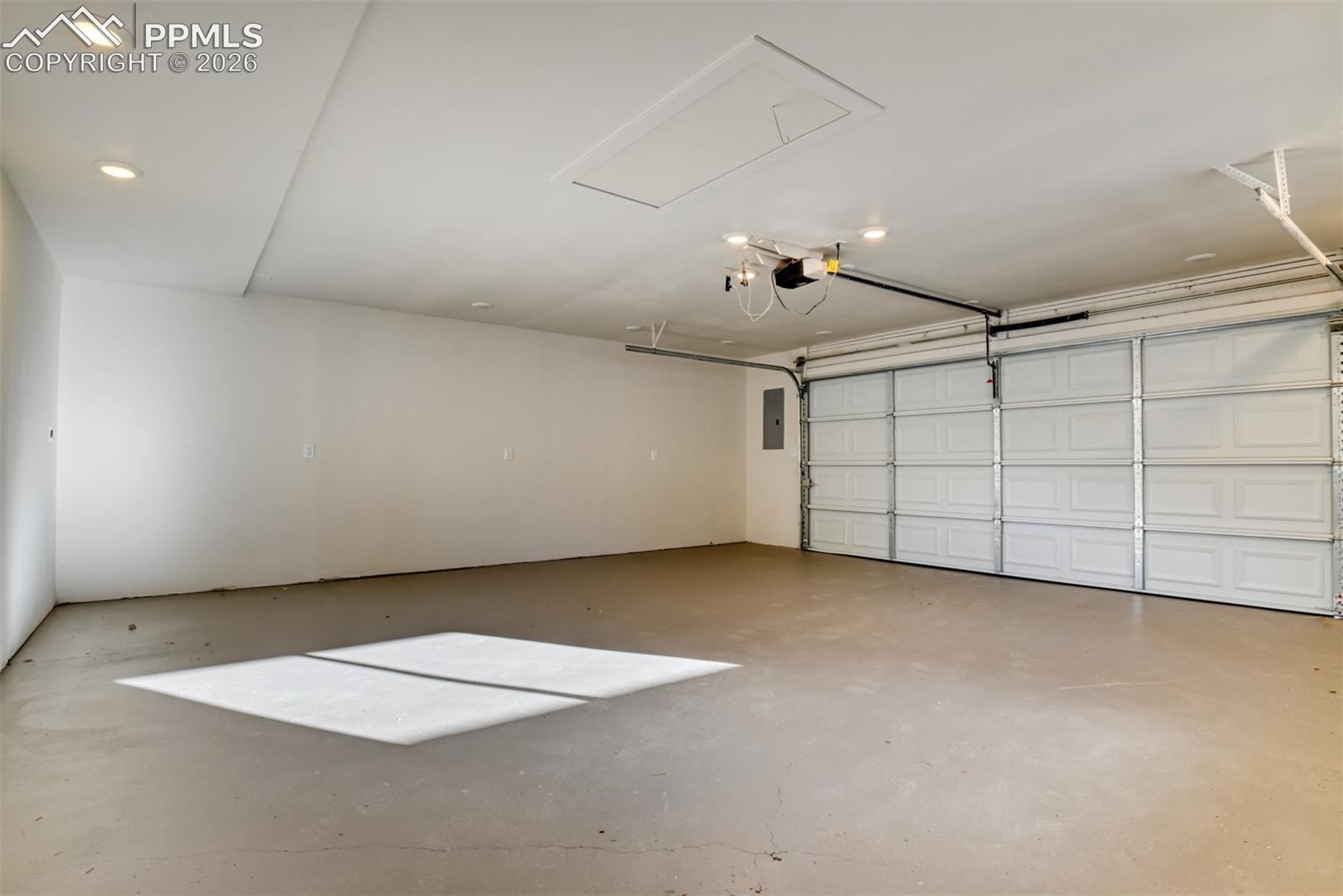 Garage featuring electric panel