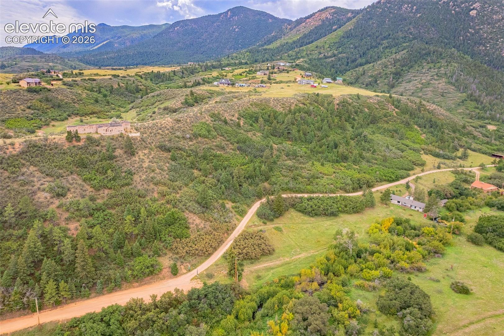 Expansive natural landscape with varied topography and distant mountainous terrain