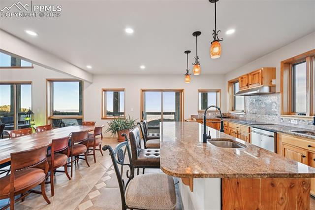 Kitchen highlighting the spacious island and walk out to the back deck