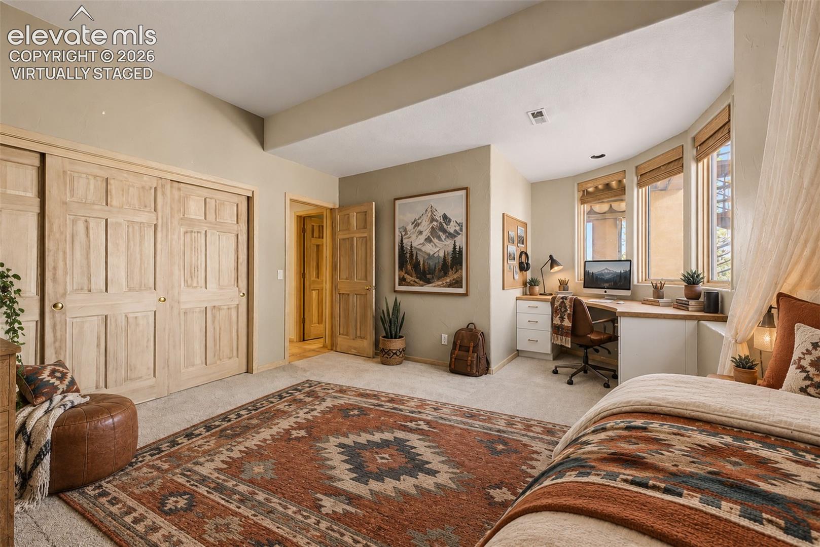 Virtually Staged
Built-in workstation with bay windows, natural wood-finish closet doors, and neutral wall tones