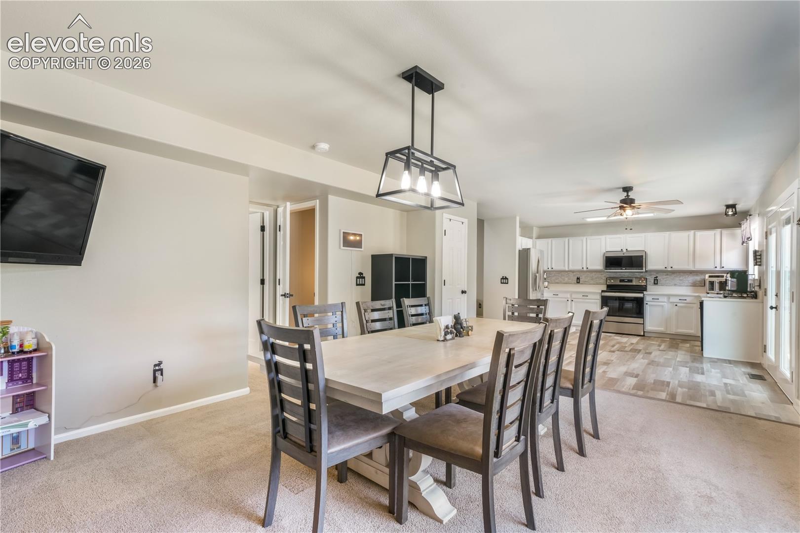 Currently staged as dining area, also family room with gas fireplace