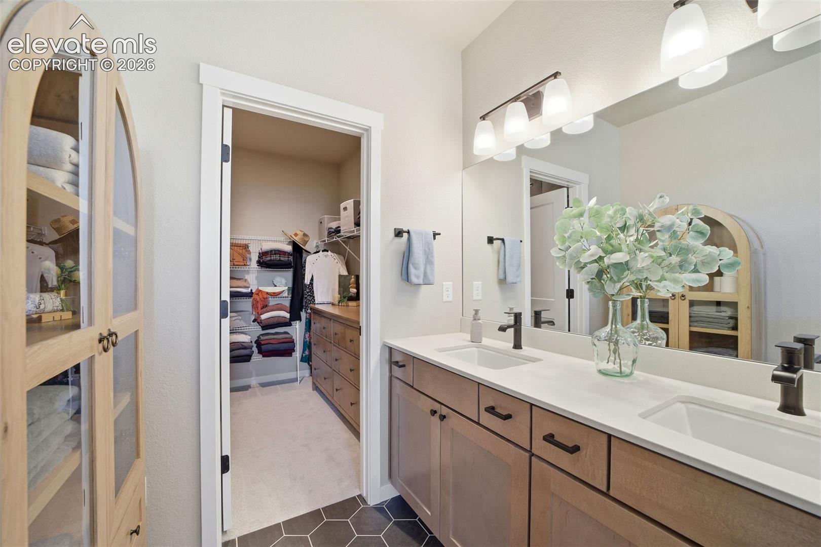 On-suite Primary bathroom with styled, timeless design pieces. 