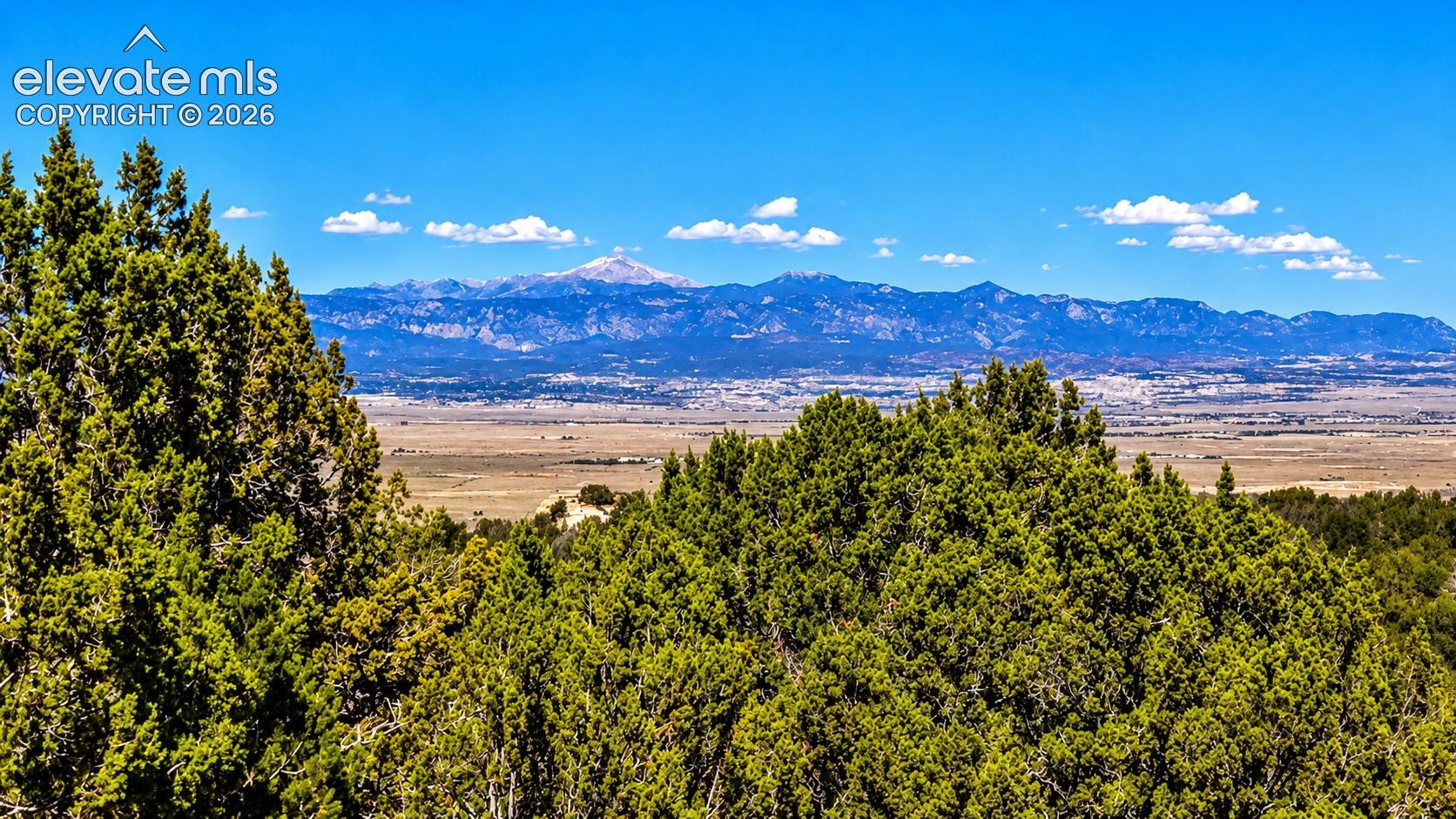 Stunning views of snowcapped Pikes Peak and the Front Range rising above the valley below. A beautiful combination of mountain scenery, natural vegetation, and wide-open spaces.

