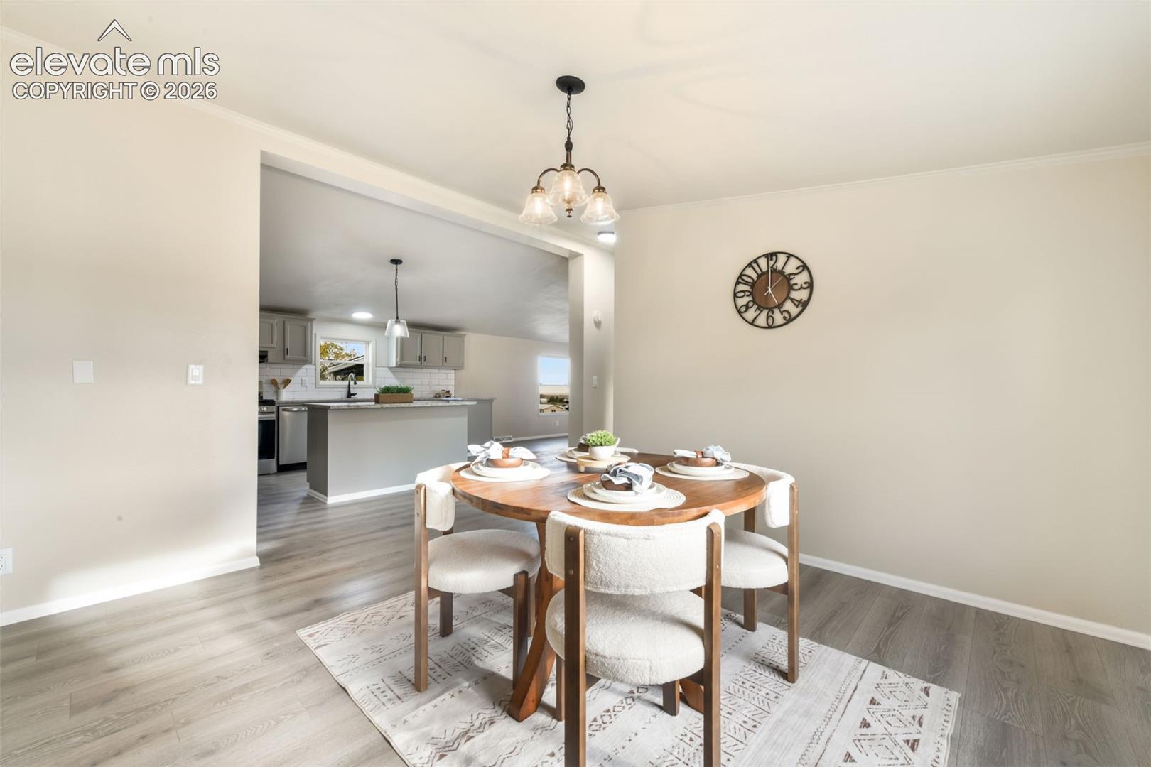 Recessed lighting, wood-finish flooring, and an open-concept layout