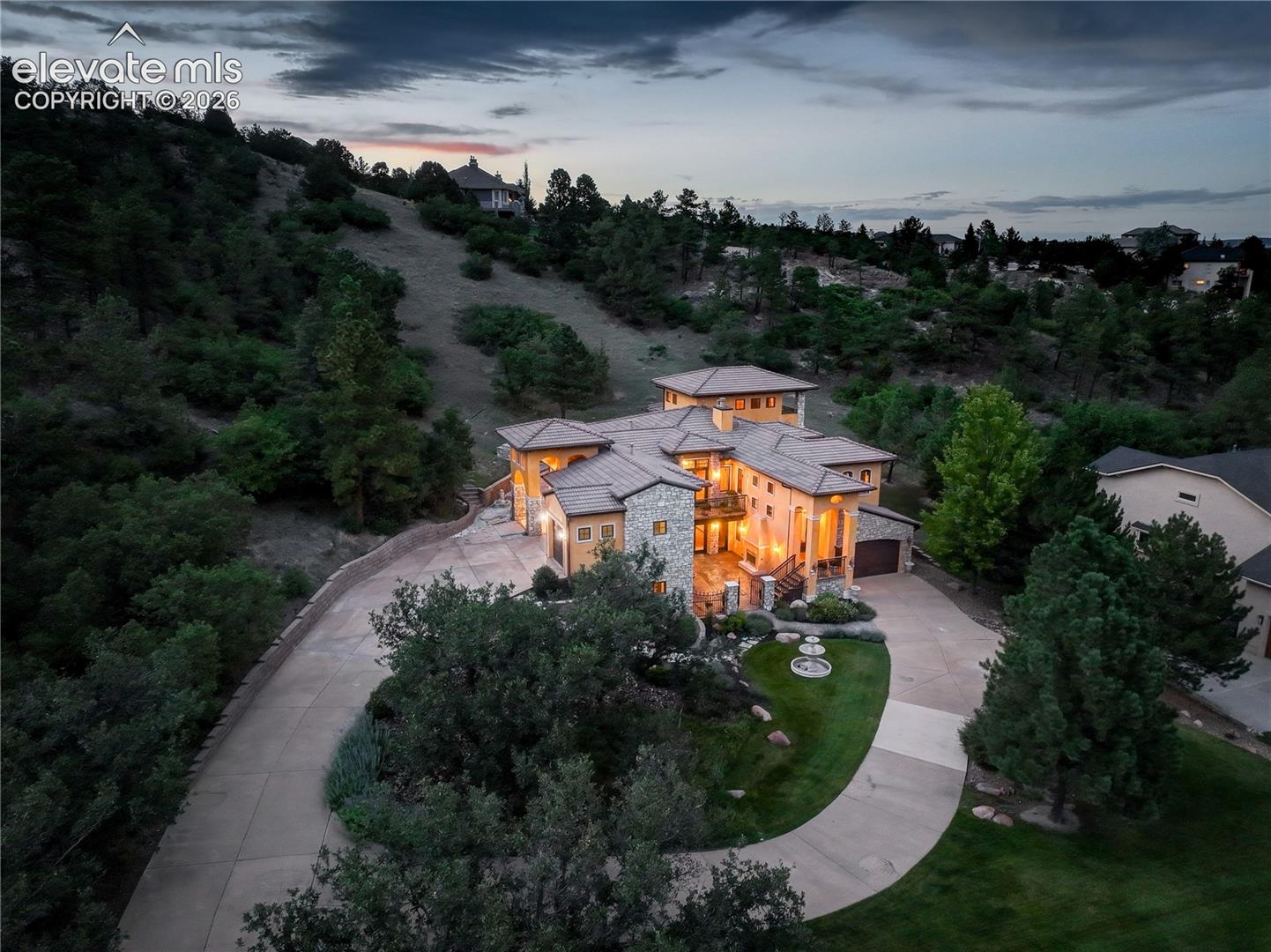 View of residence and driveway promenades.