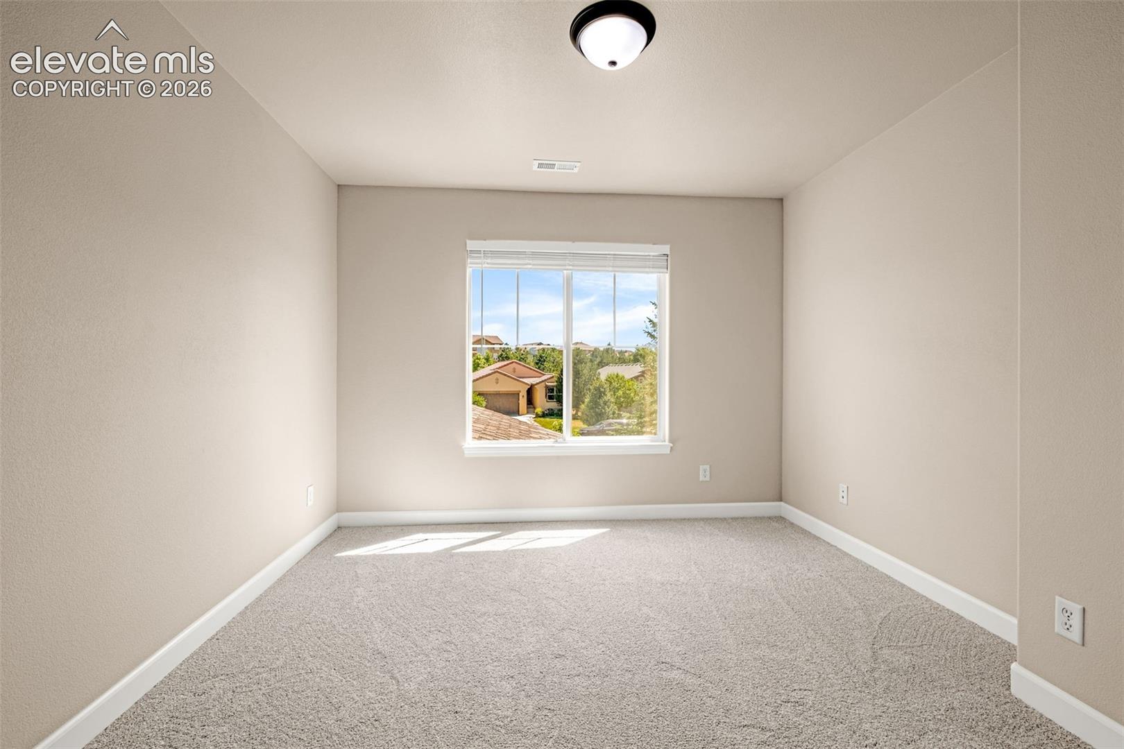 Upper Level Bedroom 4; new carpet, new baseboards, new lighting, new blinds and boasts a walk-in closet.  