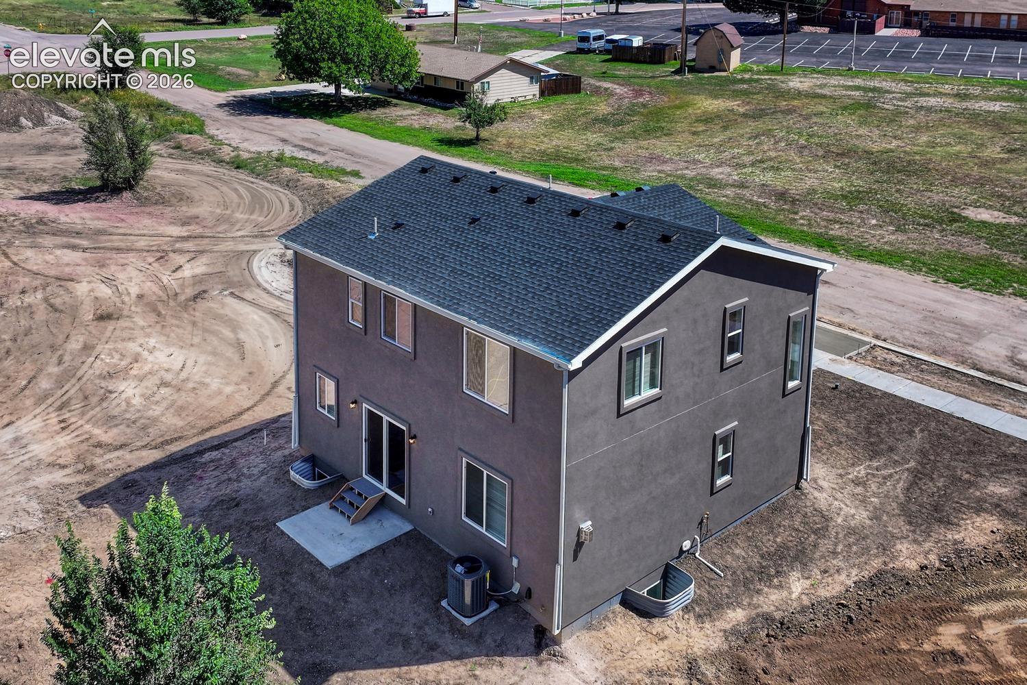 Xeriscape landscaping, rear privacy fence, and auto sprinkler pre-plumbing are included standard (not depicted)