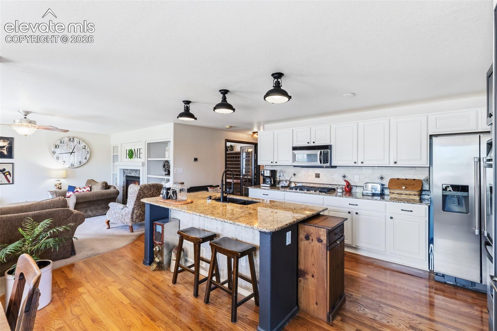 Granite Countertops, Island Seating & Stainless Steel Appliances
