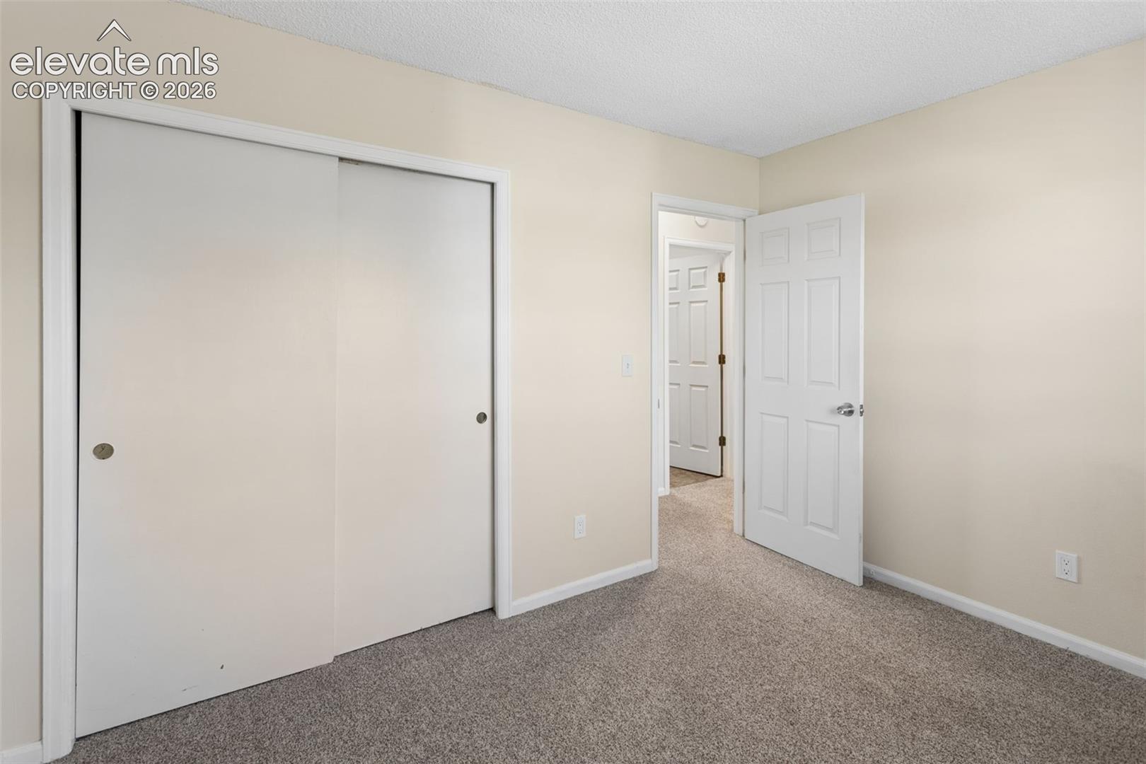 Bedroom two with carpet