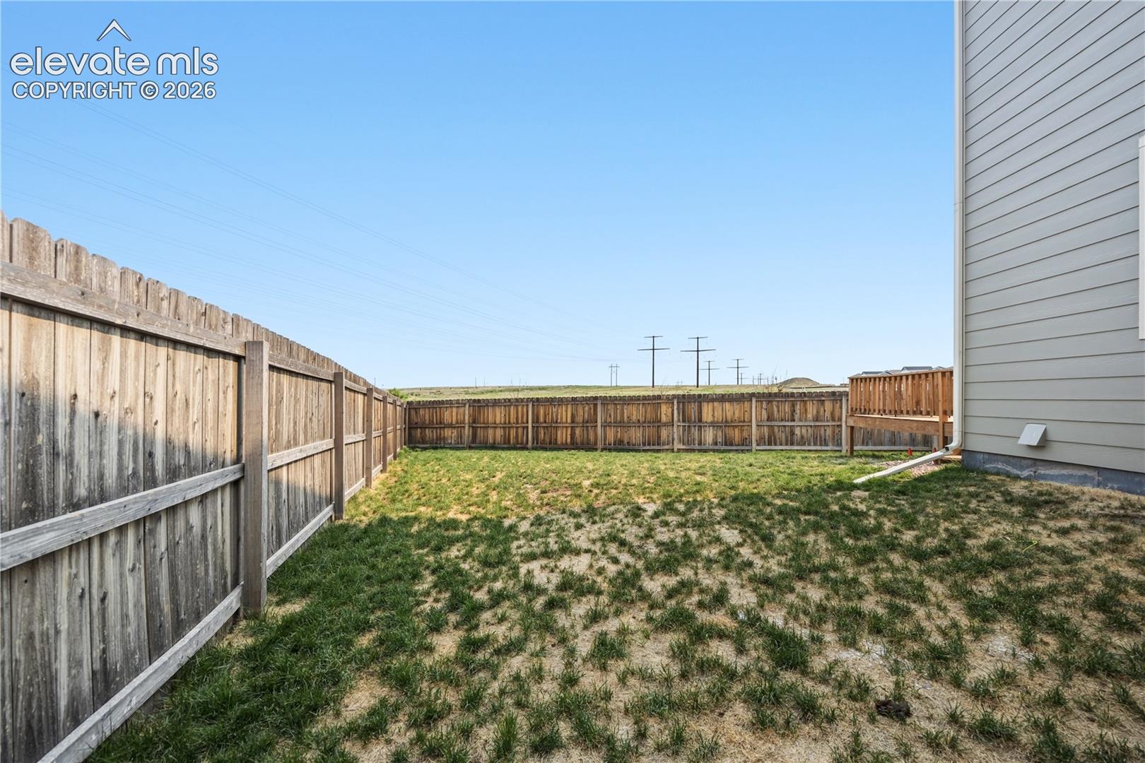 Fenced side yard.