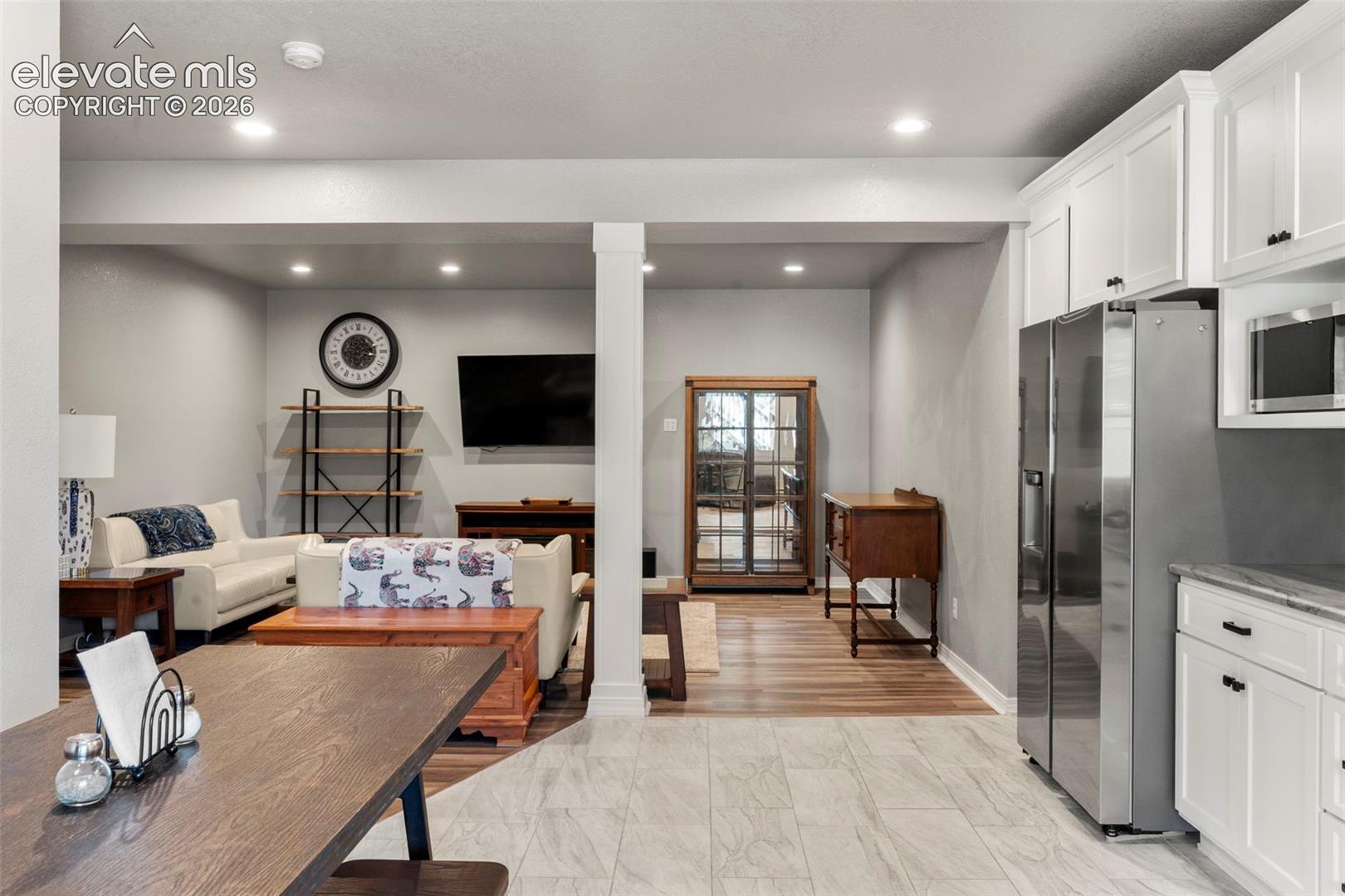 Living room featuring recessed lighting and baseboards
