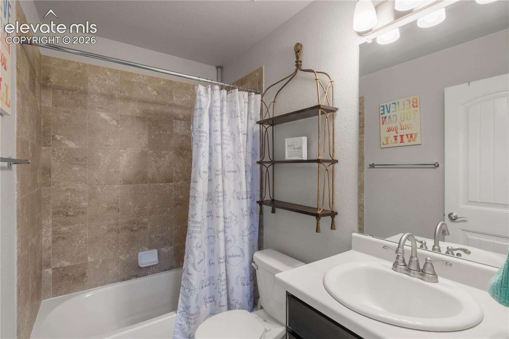 White vanity with an integrated sink and chrome faucet