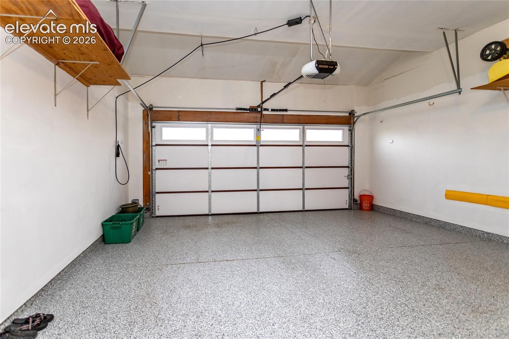 Fully Finished Garage Parking Area w/ Shining Epoxy Flooring and plenty of Light