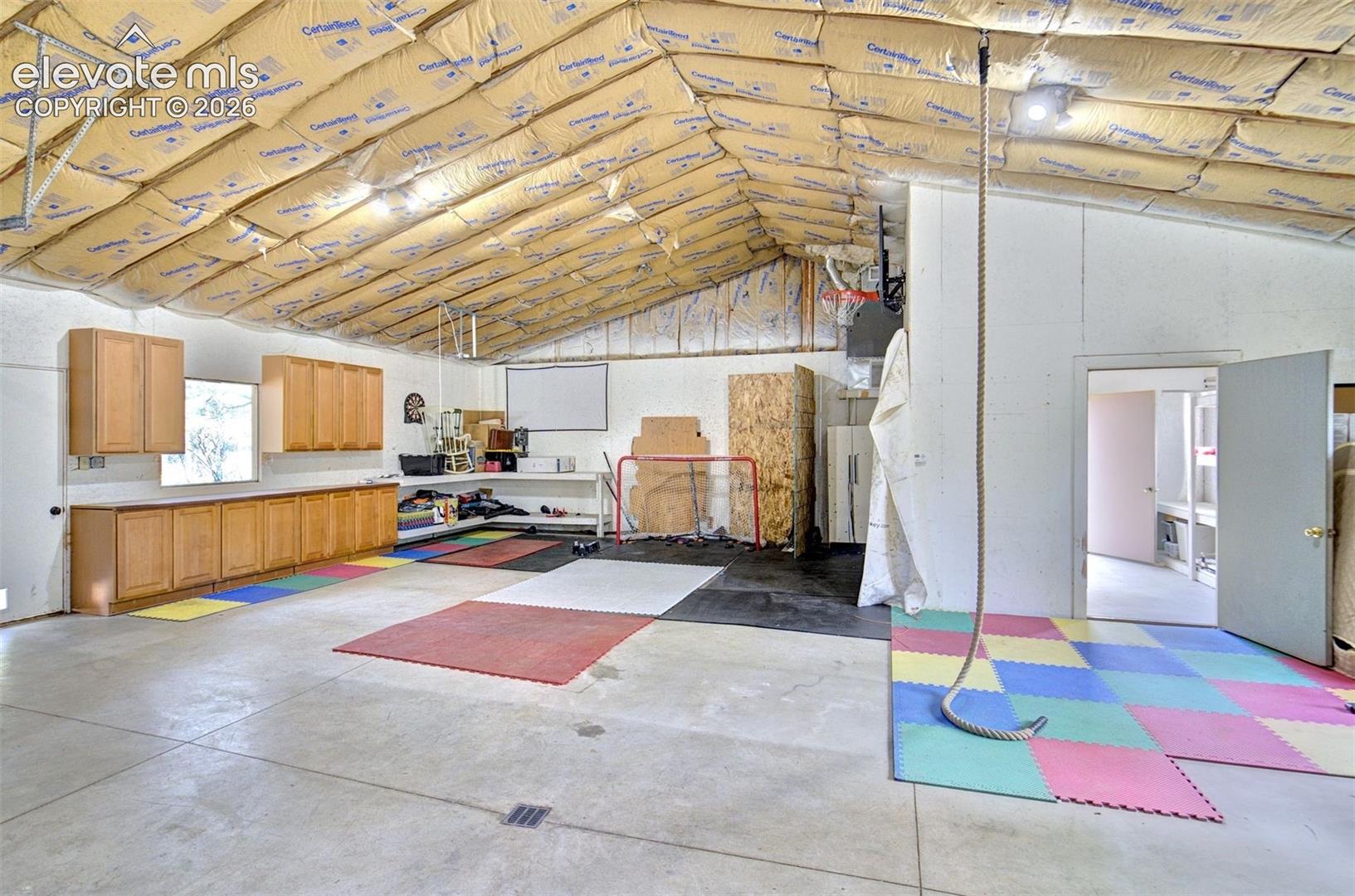 Outbuilding with one car garage bay