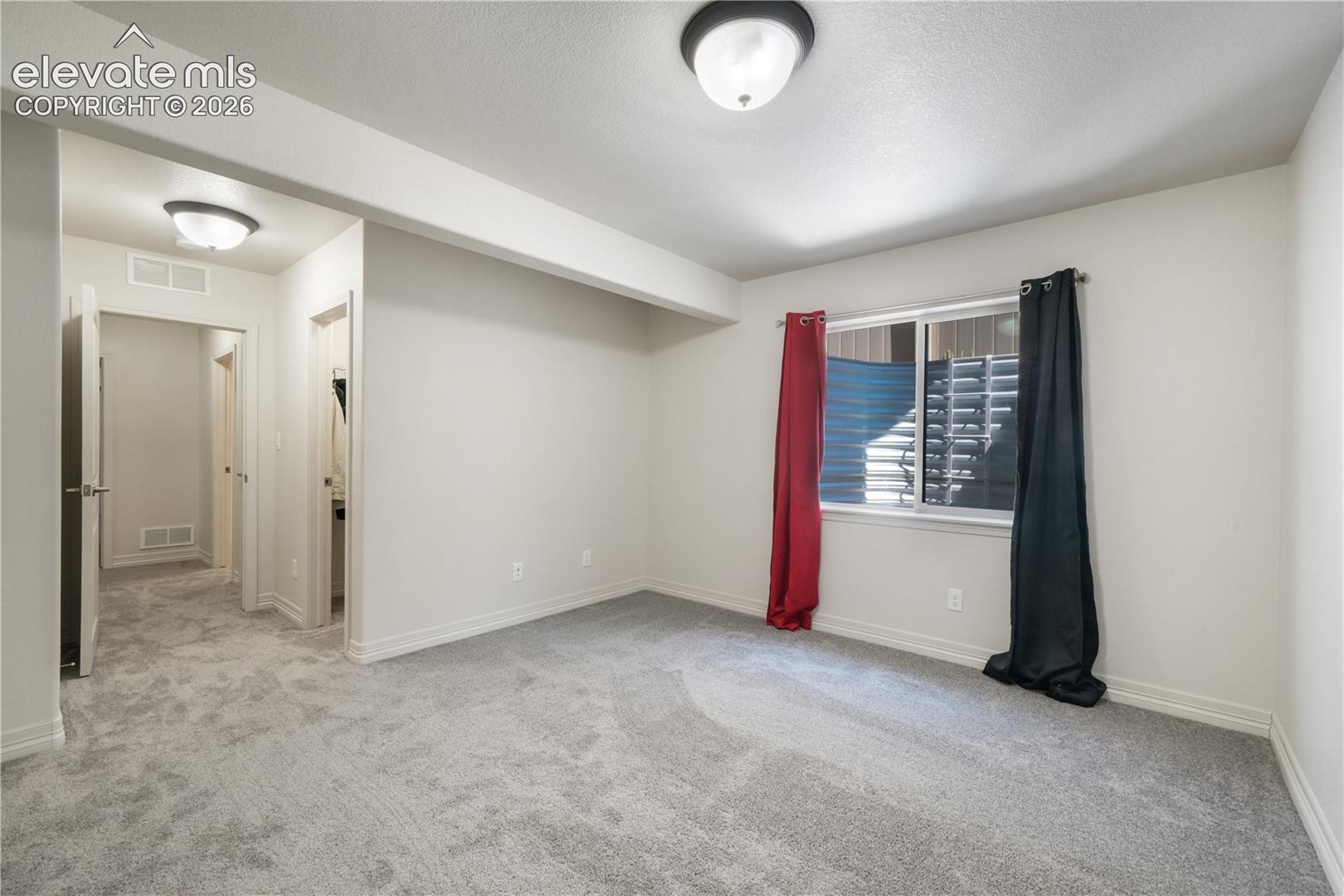 Basement 4th bedroom with large walk in closet and new carpet