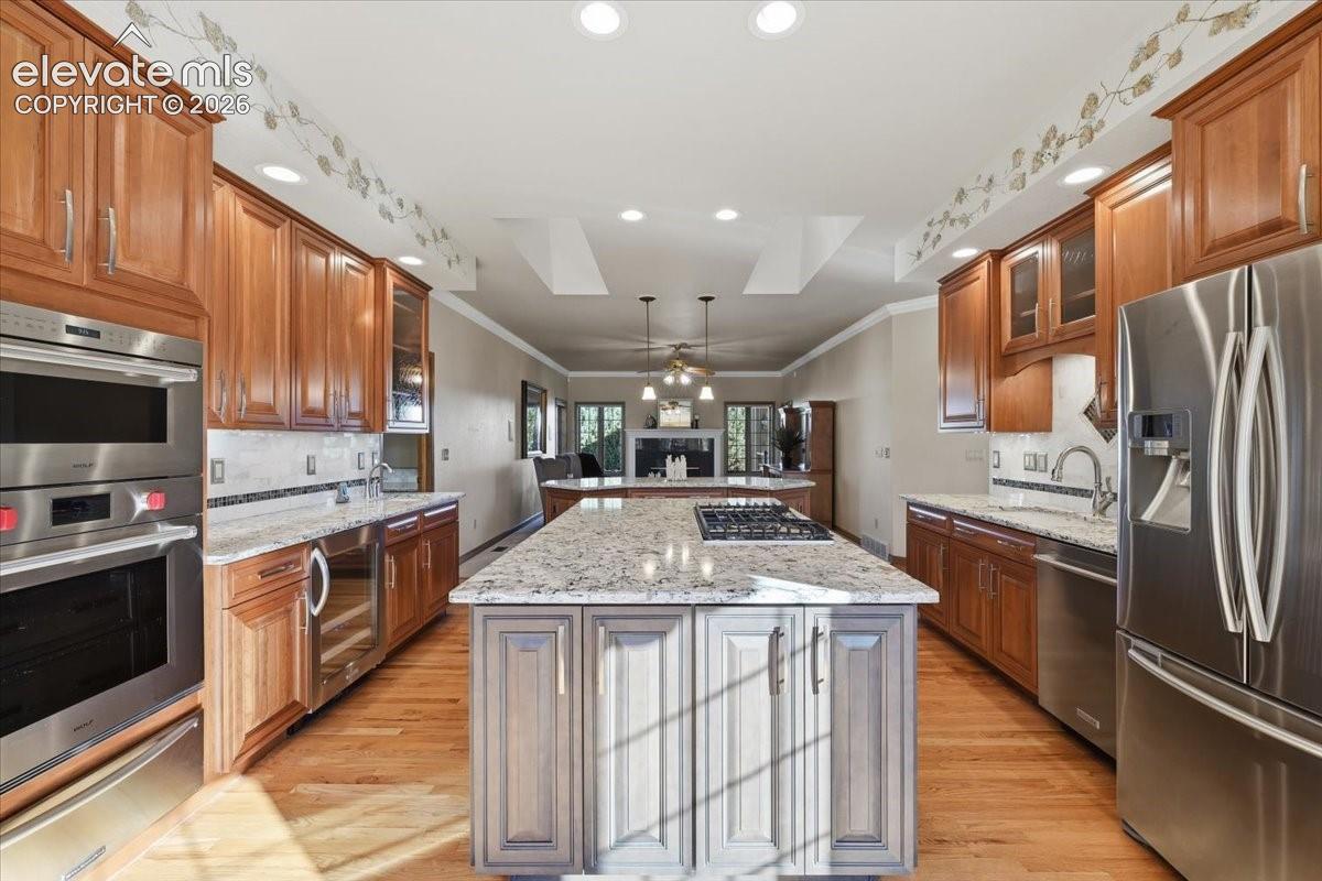 Upgraded appliances, including a Wolf microwave/oven/warming drawer, Kitchen aid dishwasher and wine chiller