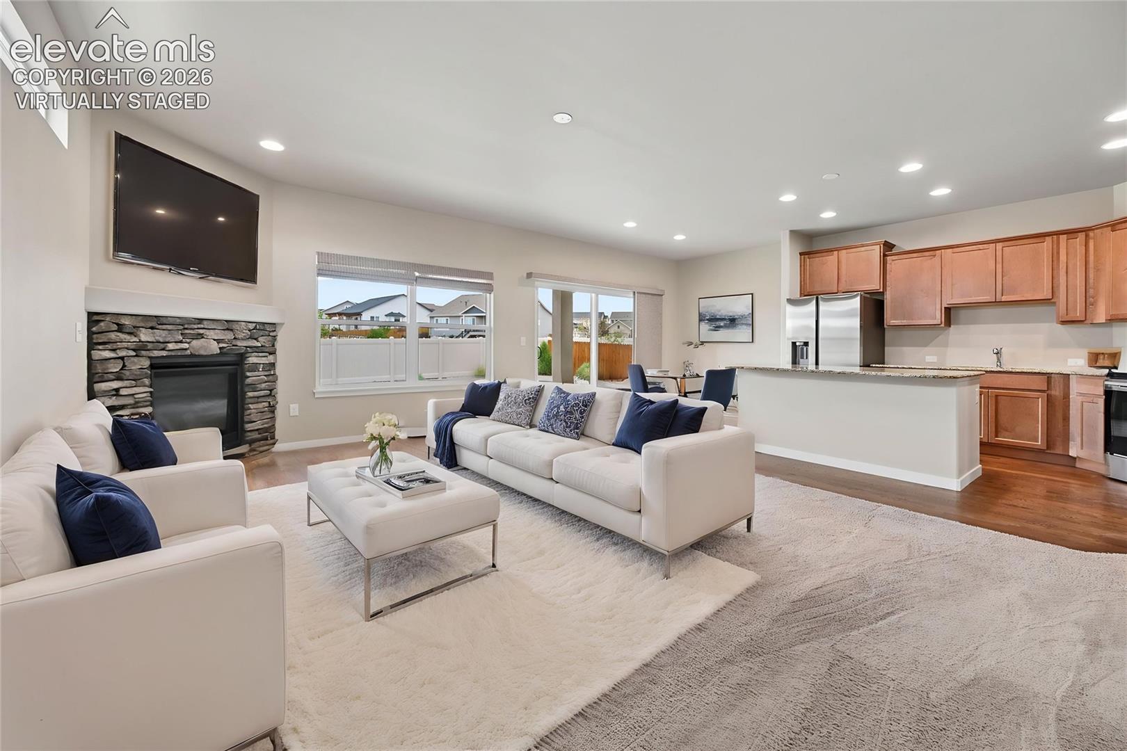 Virtually Staged Photo of Living room looking at kitchen