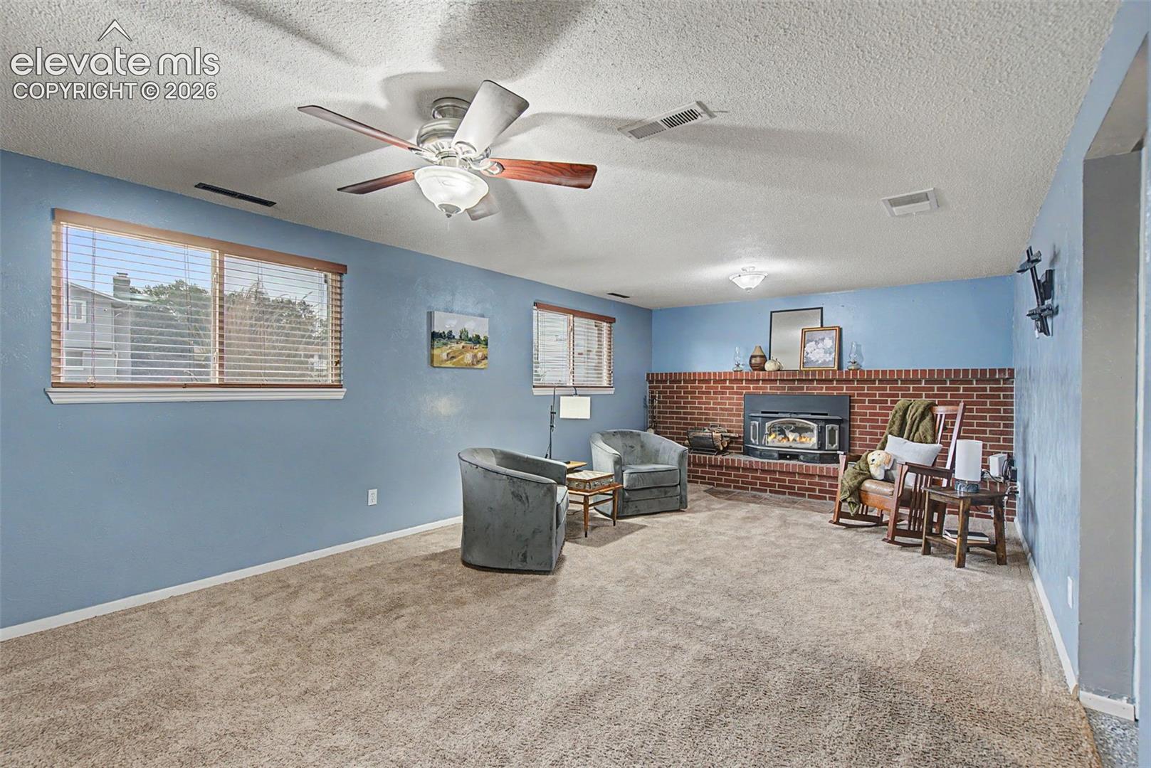 Lower-Level Rec Room with Fireplace