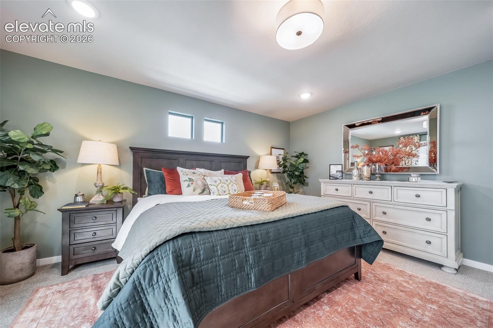 Recessed ceiling lighting complements a central drum light fixture
*Photos of a model home*
