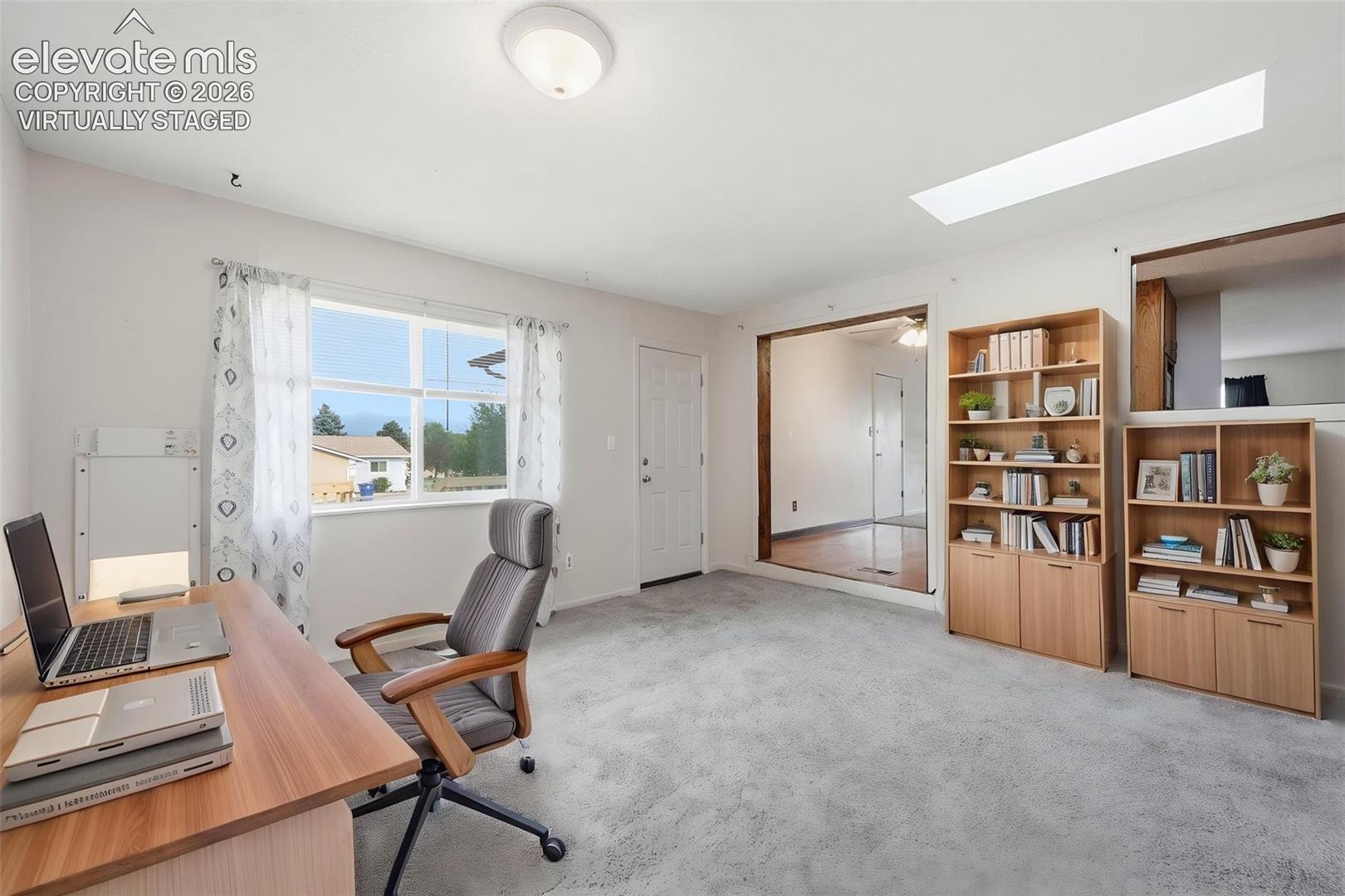 Virtually Staged Family Room as Office 