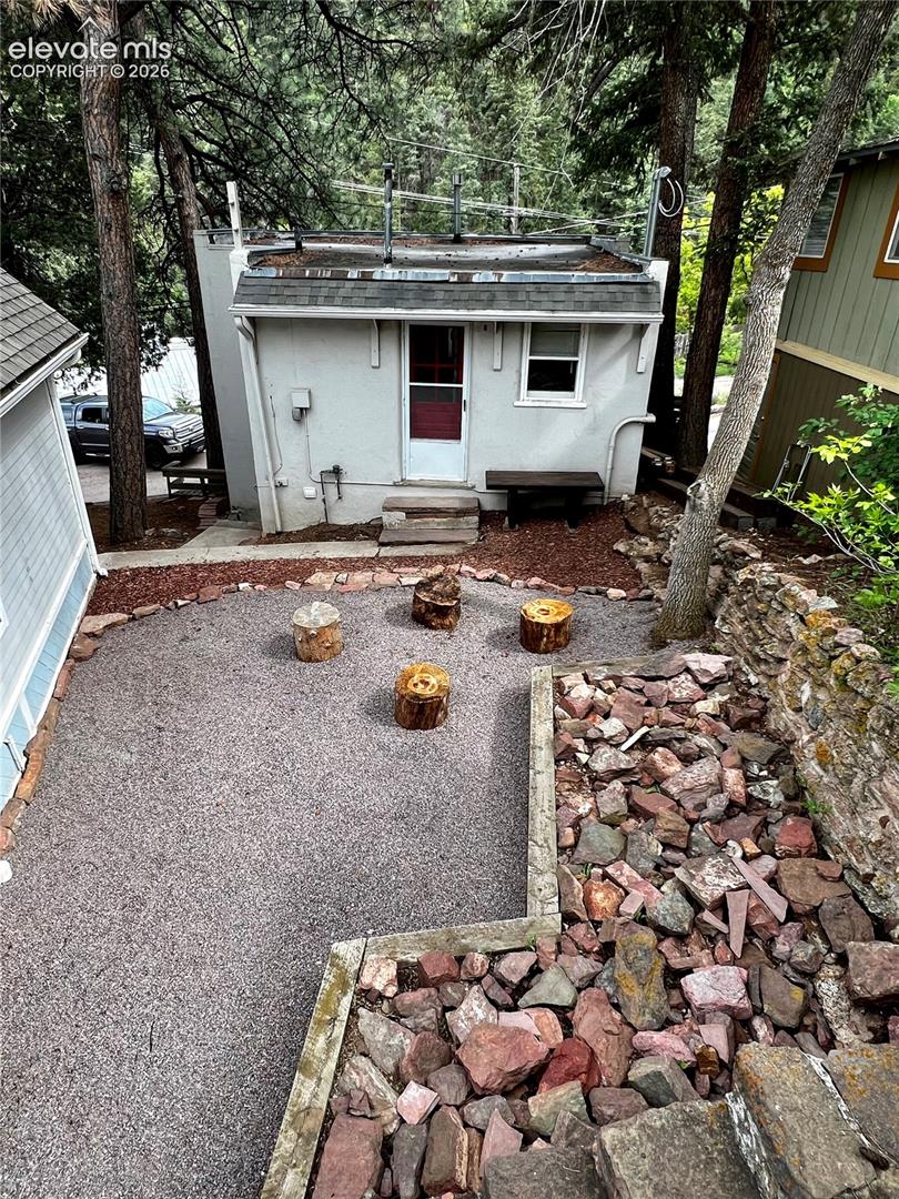 Upper Apt: View from patio to the upper unit. The exterior entrance to the lower unit is down the steps to the left