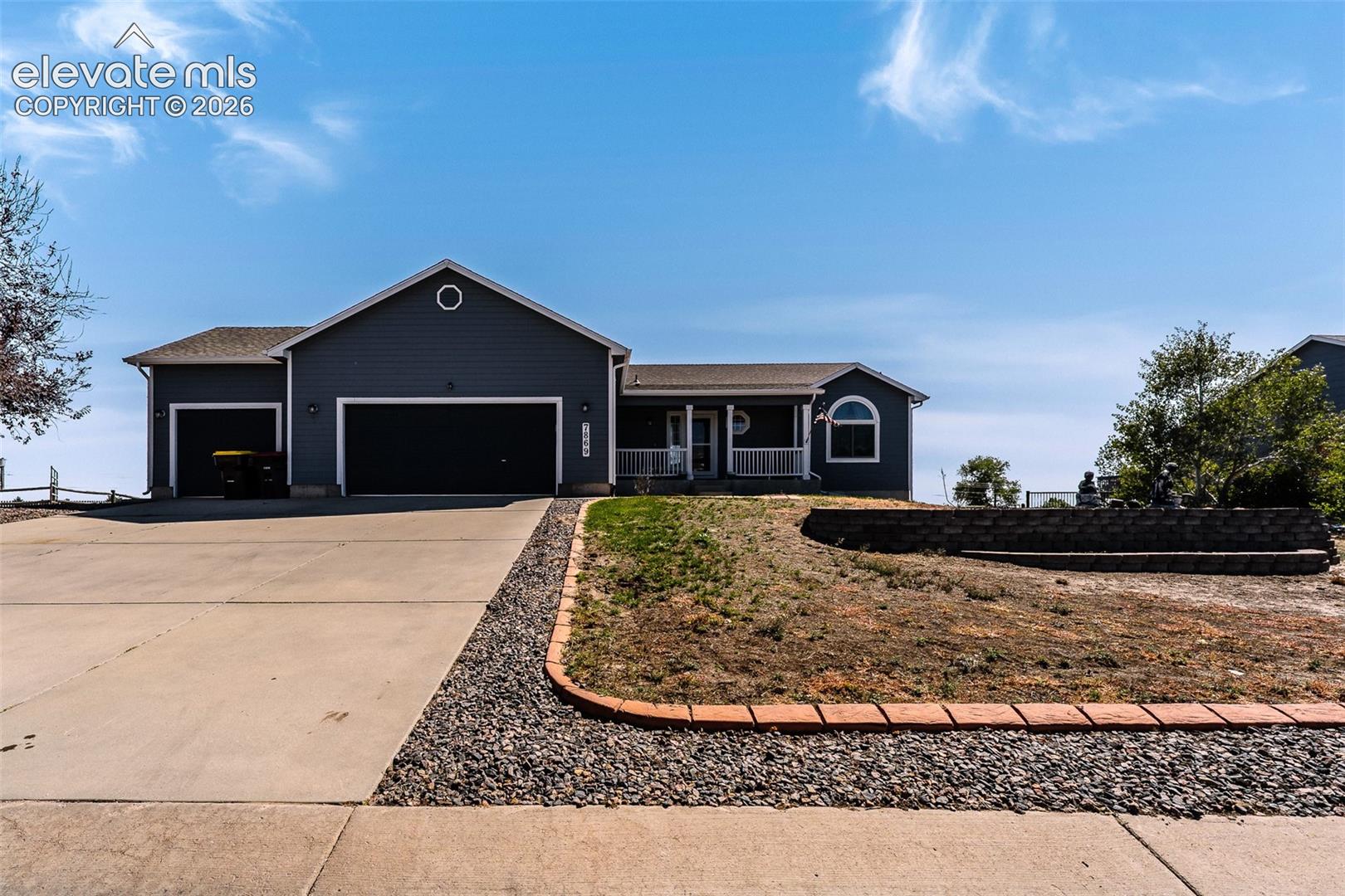 Beautifully maintained ranch style home with 3-car garage and covered front porch.