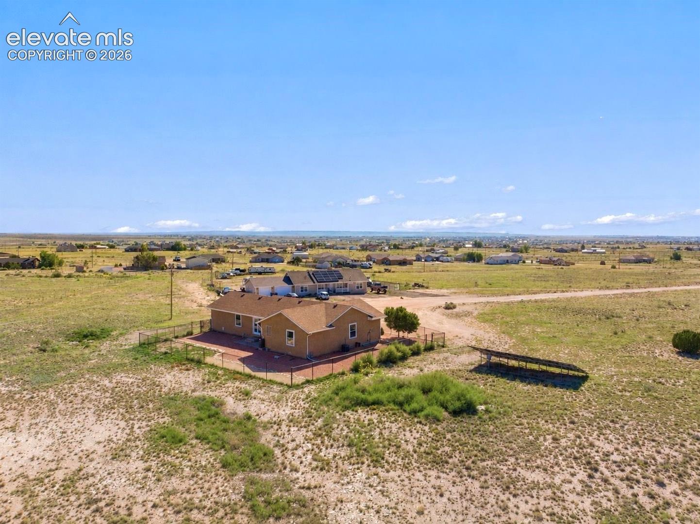 Fenced dog run area. Property is 1.32 acres.