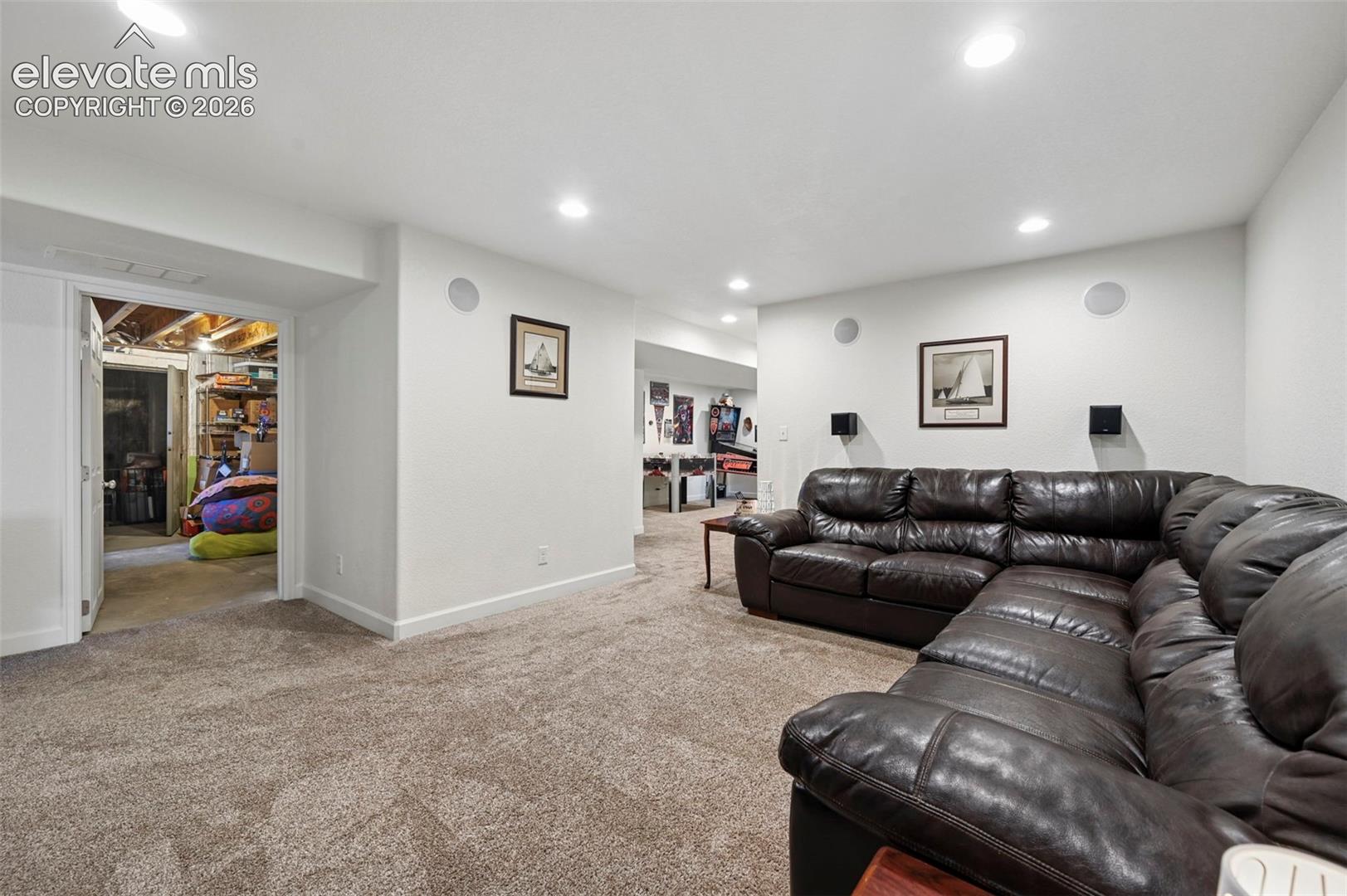 Large Family Room in Basement looking to storage room