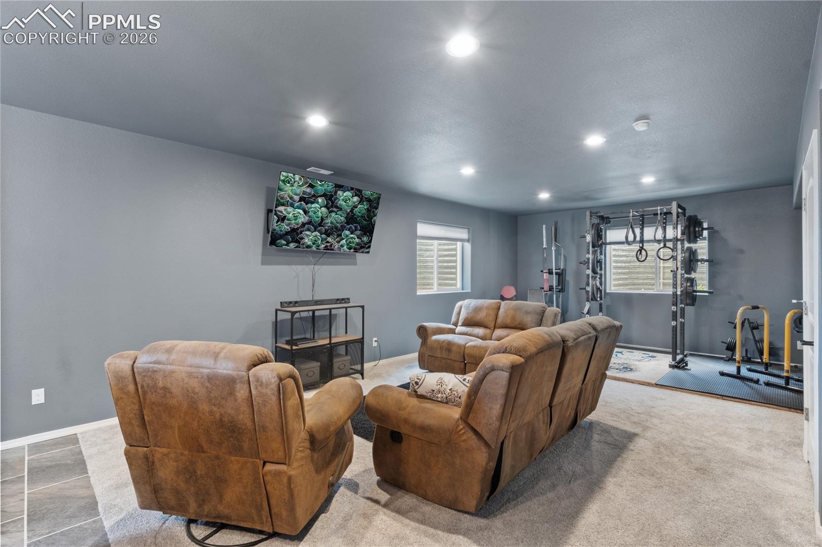 2nd Living room with recessed lighting and baseboards