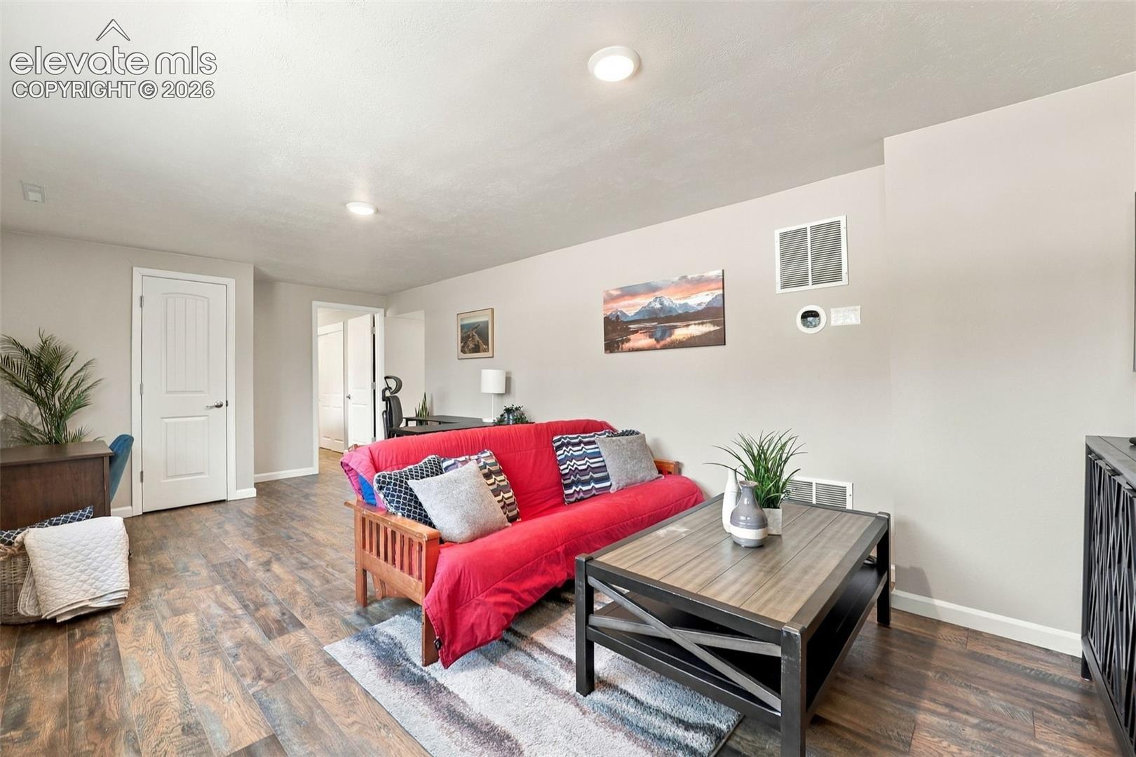 Living room in lower level with updated luxury vinyl flooring!