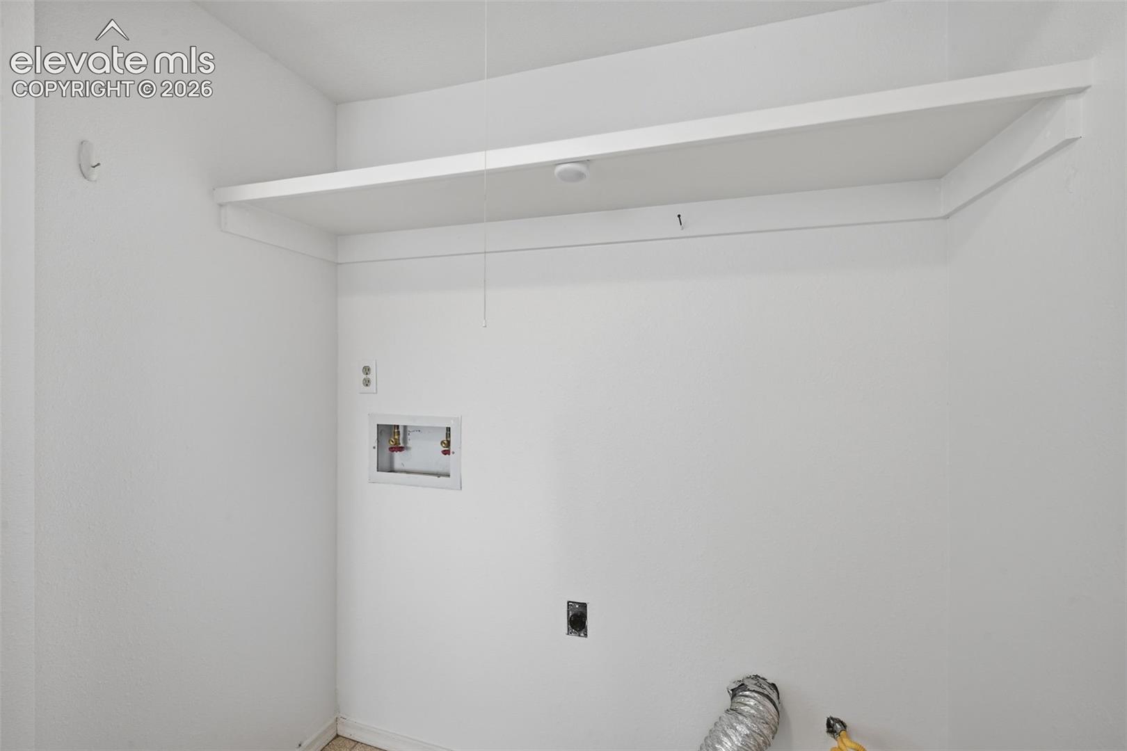 Basement laundry closet plumbed for gas dryer or electric.