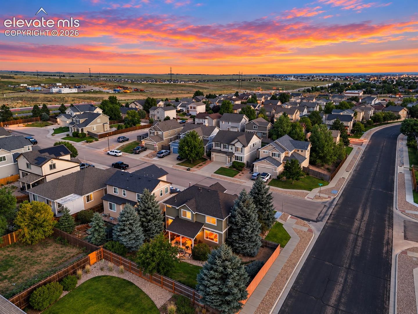 An elevated view showcases the beautifully maintained backyard and desirable corner-lot setting, offering extra openness and a wonderful sense of space around the home.