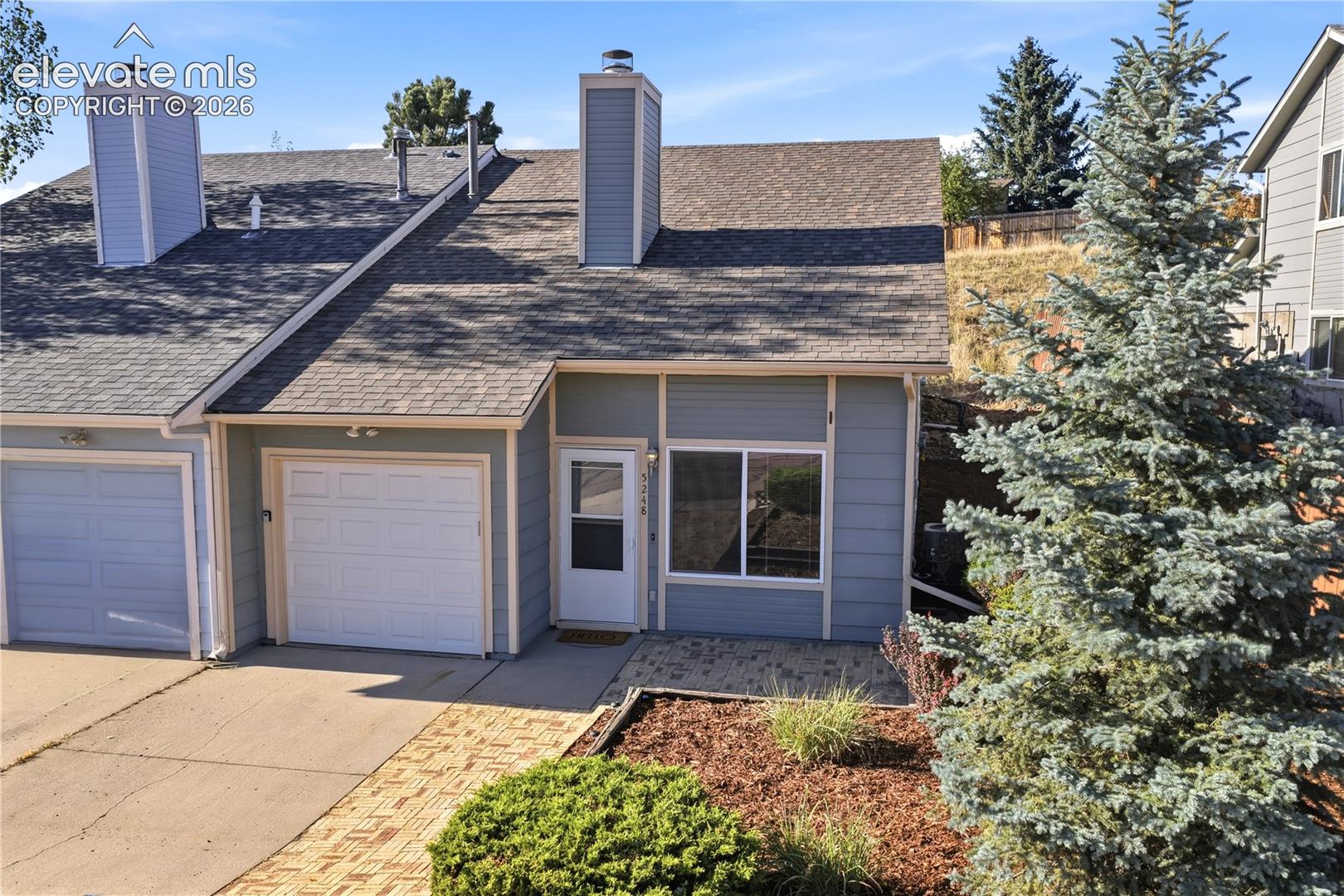 Welcome home to this well-maintained 3-bedroom, 2-bath townhome offering a comfortable floor plan, and NO HOA just off the Powers Corridor * Thoughtful updates and beautiful mountain views * The inviting main level features soaring ceilings, spacious living room with fireplace and built-ins and an adjoining dining area that flows easily into the kitchen which offers a breakfast bar, pantry, newer dishwasher, newer linoleum flooring and new kitchen faucet * Two bedrooms are conveniently located on the main level with convenient full bath, while the upper level features an additional Primary with spacious walk-in closet and attached bathroom, along with the dedicated laundry area * Recent improvements include newer carpet, furnace and water heater replaced in 2019 and a newer insulated garage door * The attached 1-car garage includes convenient garage door opener * Outside, enjoy a nicely landscaped setting, rear area boasts terrific mountain and city views, with the property backing to open space * Conveniently located near parks, schools, shopping and trails * A great opportunity to own a move-in-ready home with valuable updates with an appealing floor plan and beautiful Colorado mountain views!
