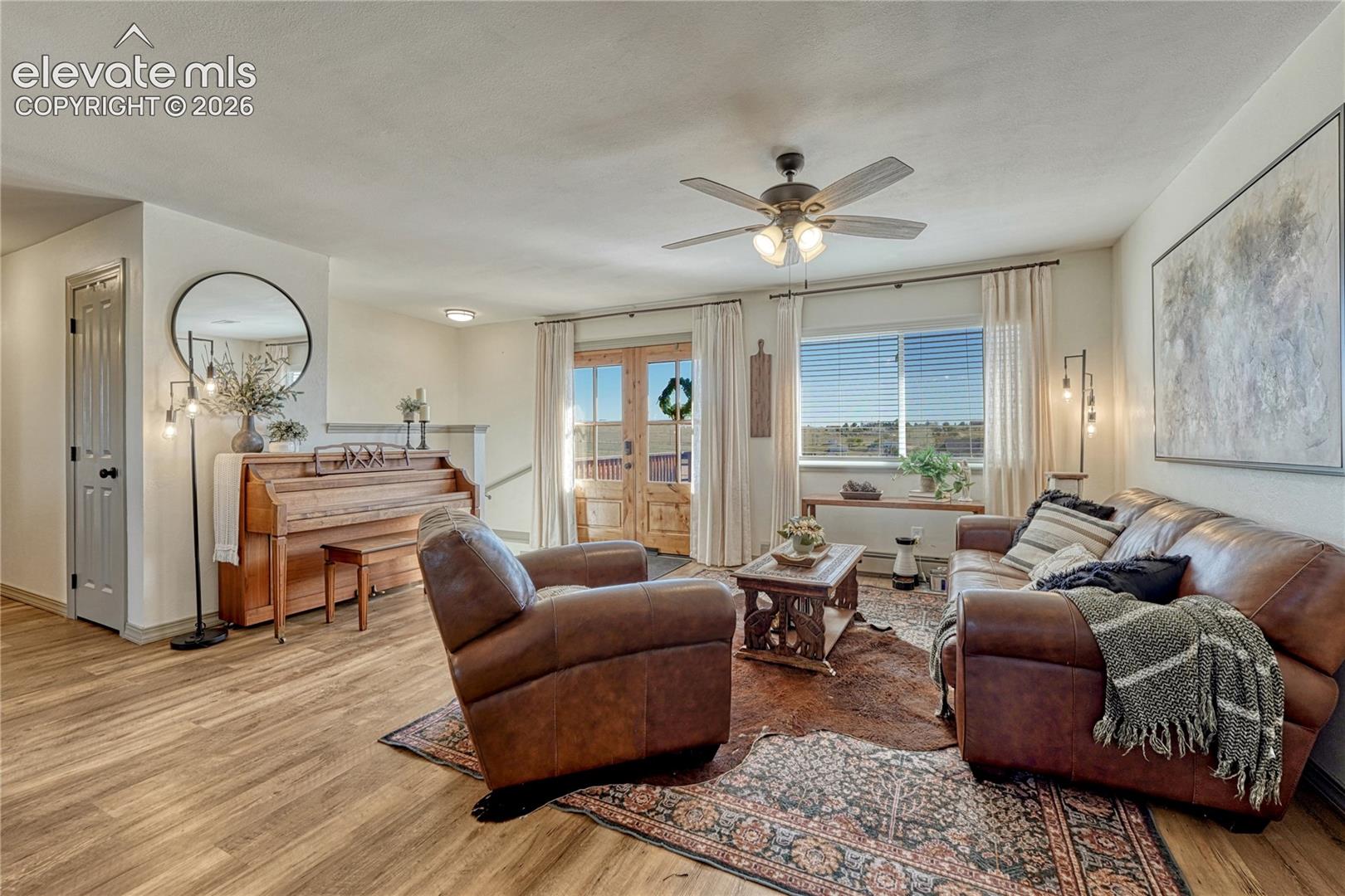 Living room with new front French doors and lots of natural light