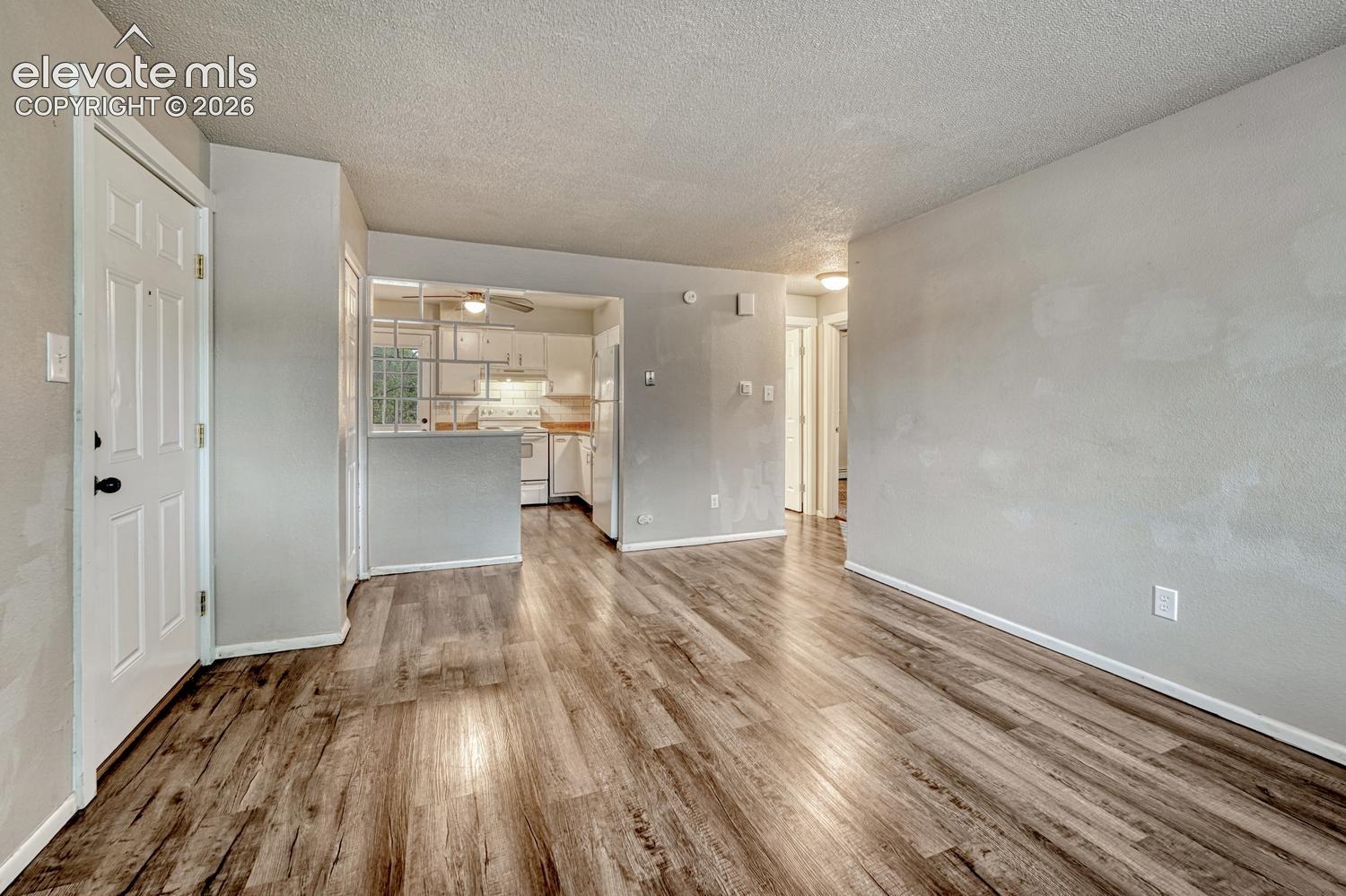 Wood-finish flooring throughout, offering a cohesive aesthetic