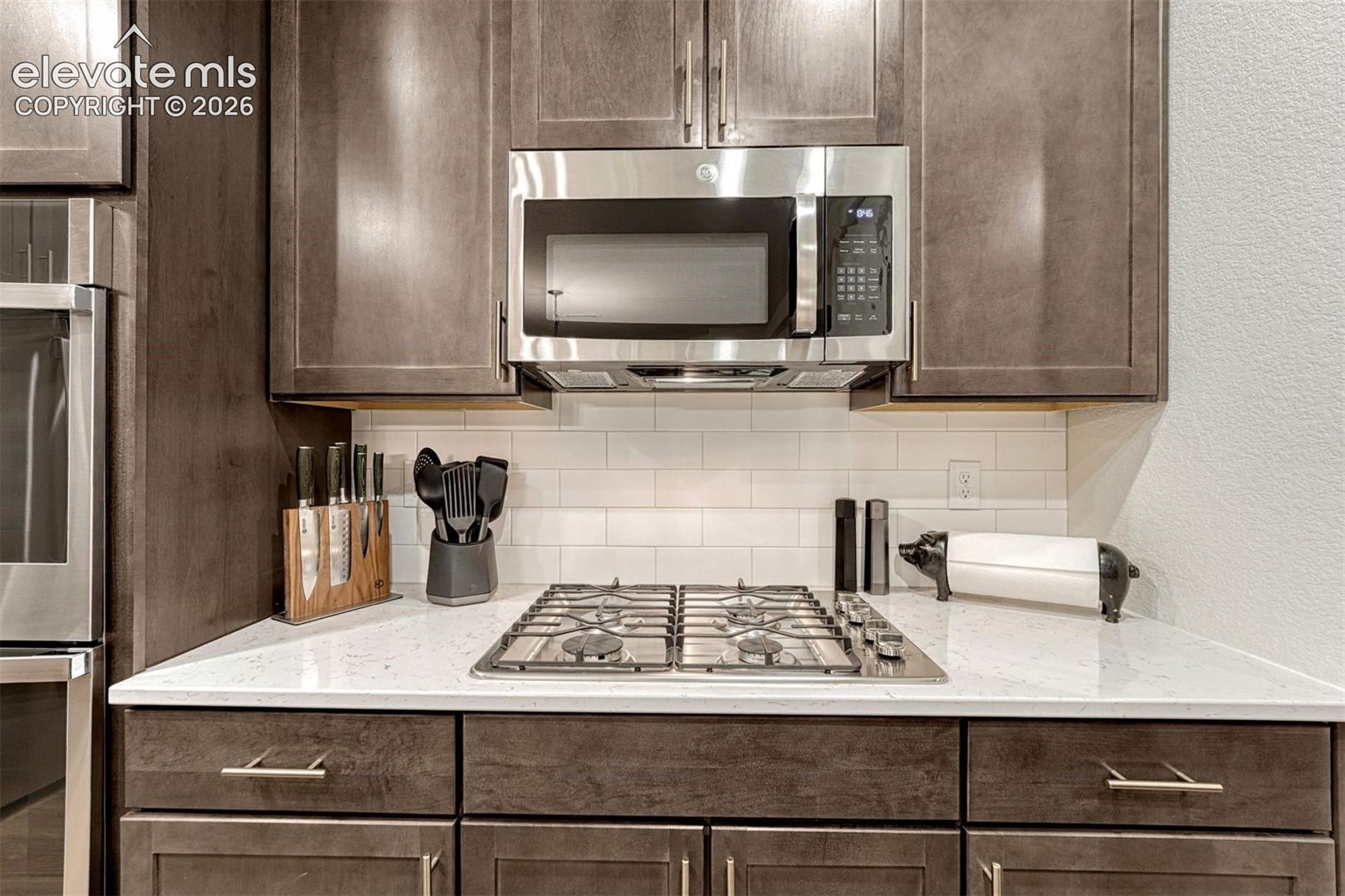 Five burner gas cook top and microwave