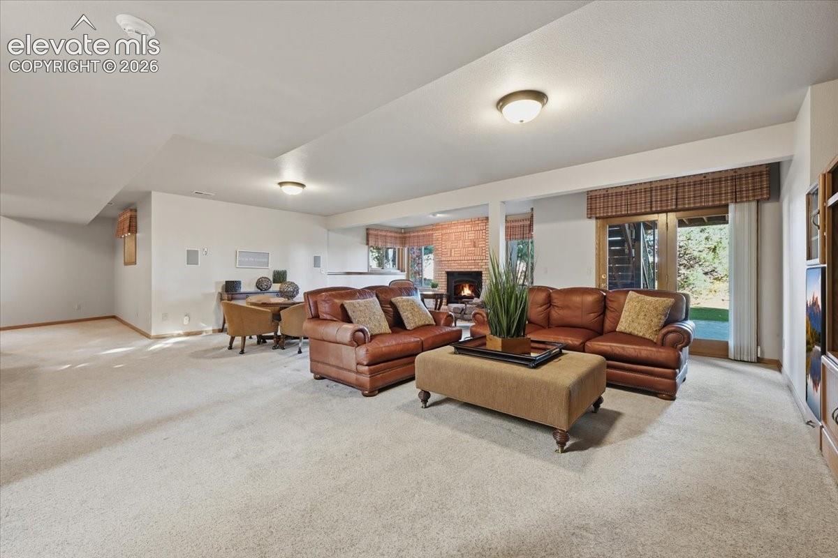 This terrific room offers a built-in media center, walk-out to the covered patio, a pool table area and a wet bar. Perfect for family night or hanging out with friends. 
