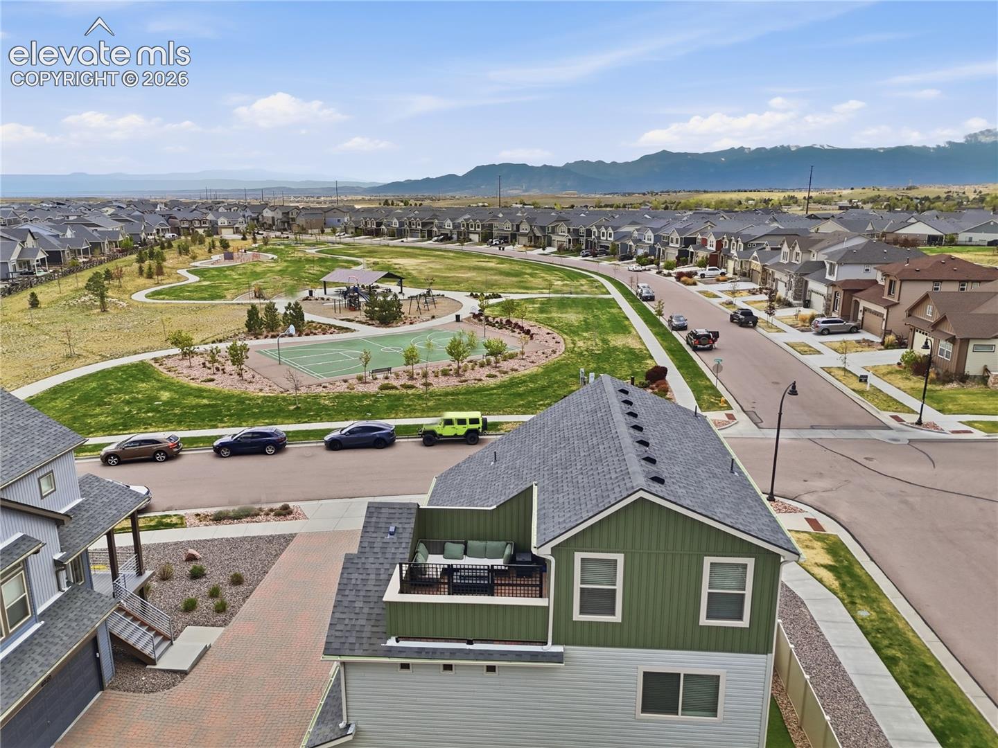Aerial perspective showcasing a modern neighborhood with an integrated community park