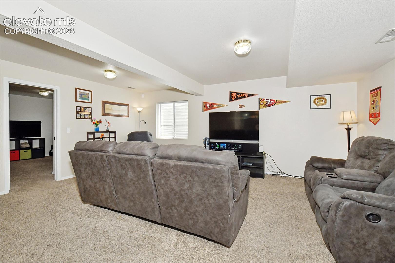 Large room with bedrooms to the left.