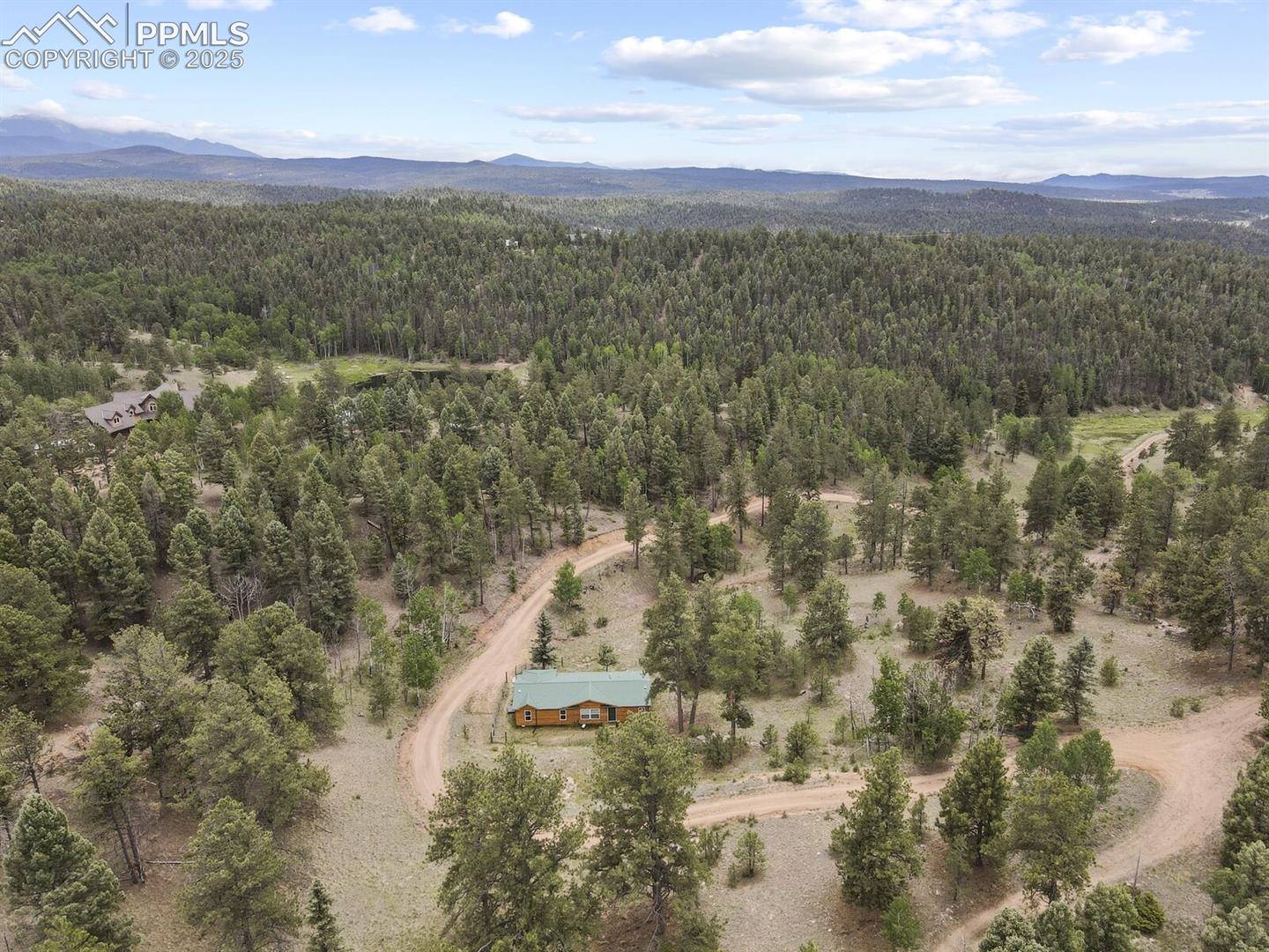 Aerial view of mountains and a heavily wooded area