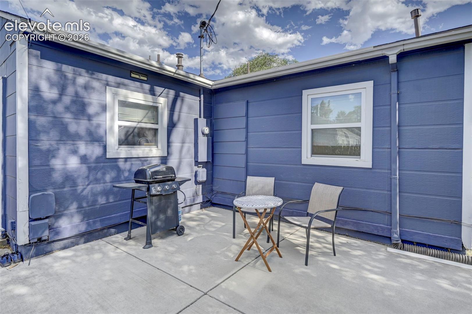 View of patio featuring area for grilling