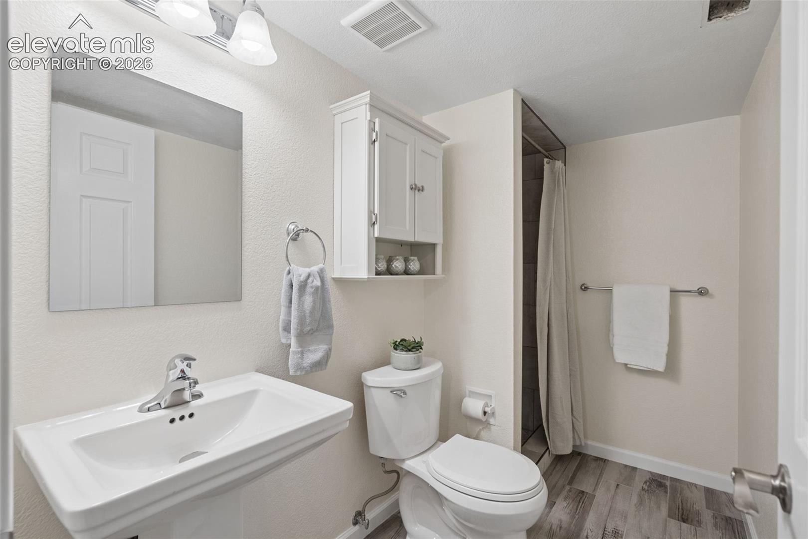 Bathroom #3 with newly tiled shower and tile flooring